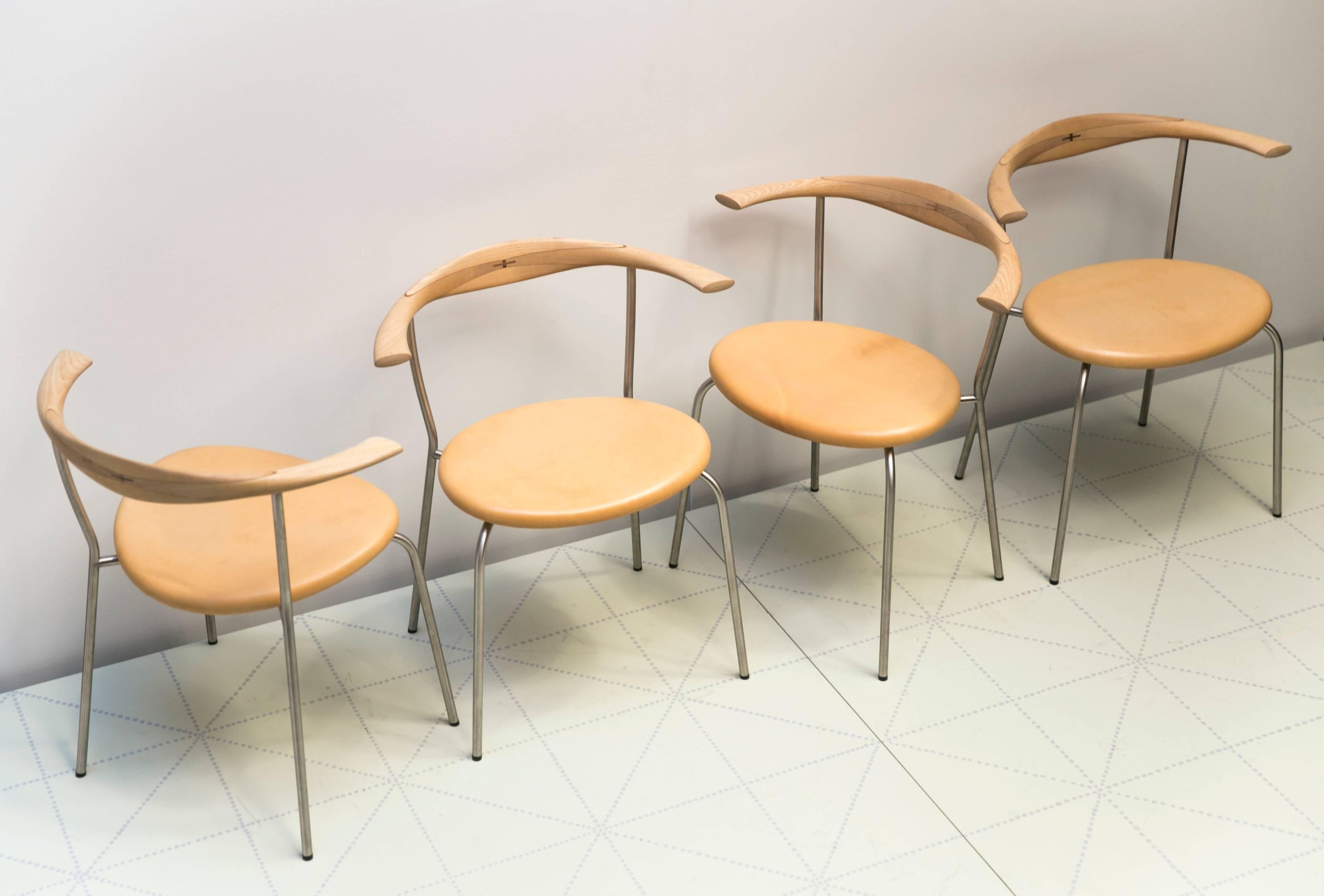 Set of Four Stackable Bull Horn Chairs, Model PP701 by Hans Wegner. Hans designed this chair to be used in the dining room of his own home in Gentofte, north of Copenhagen. It is a compact and stackable version of his famous 1960 bull horn chair and