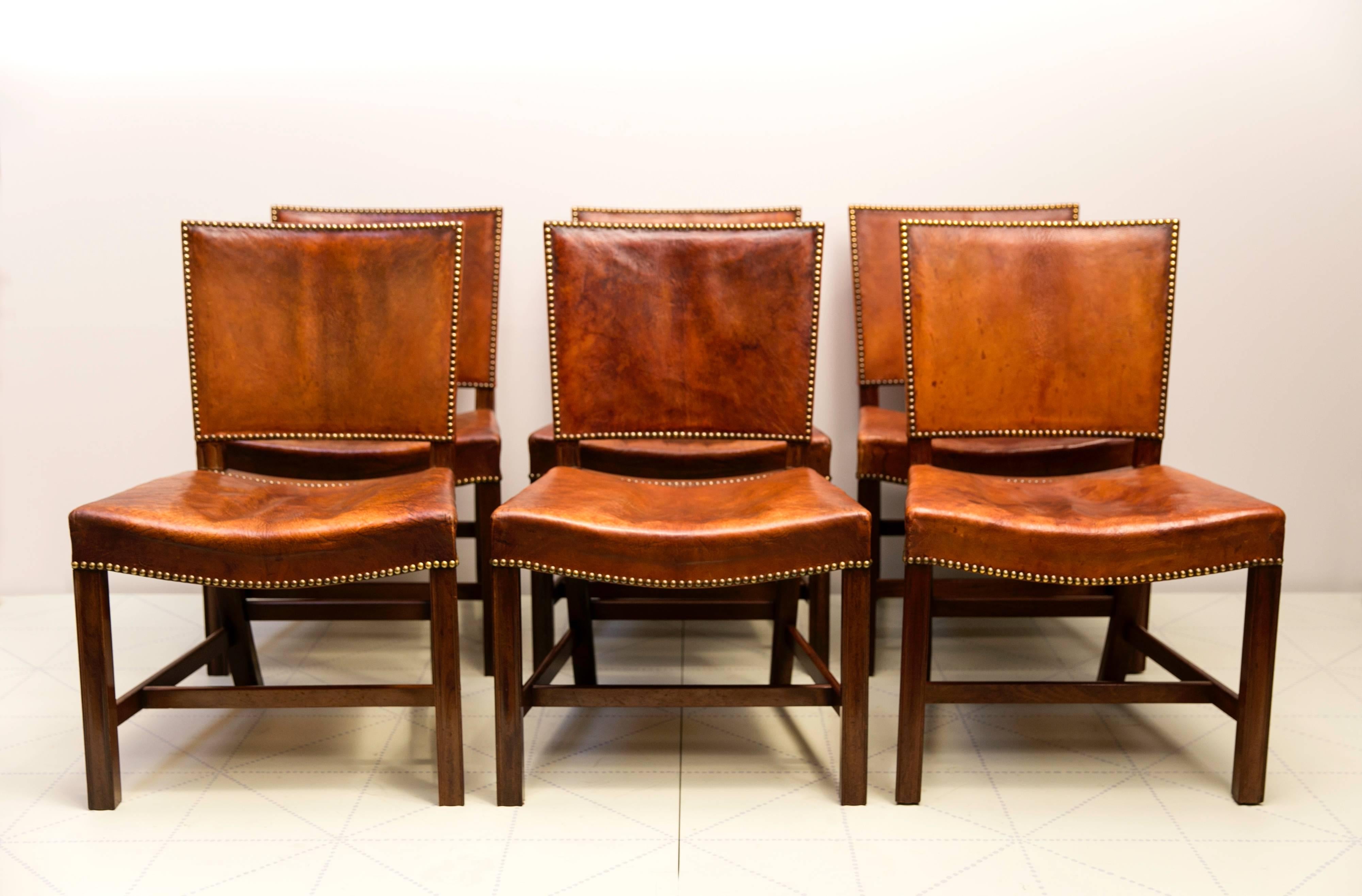 Six Large “Red Chairs” by Kaare Klint in Original Patinated Nigerian Goatskin. This early set of six chairs in Cuban mahogany retains its original highly patinated Nigerian goatskin upholstery and brass nails.

About the Red chair.
The “Red Chair”