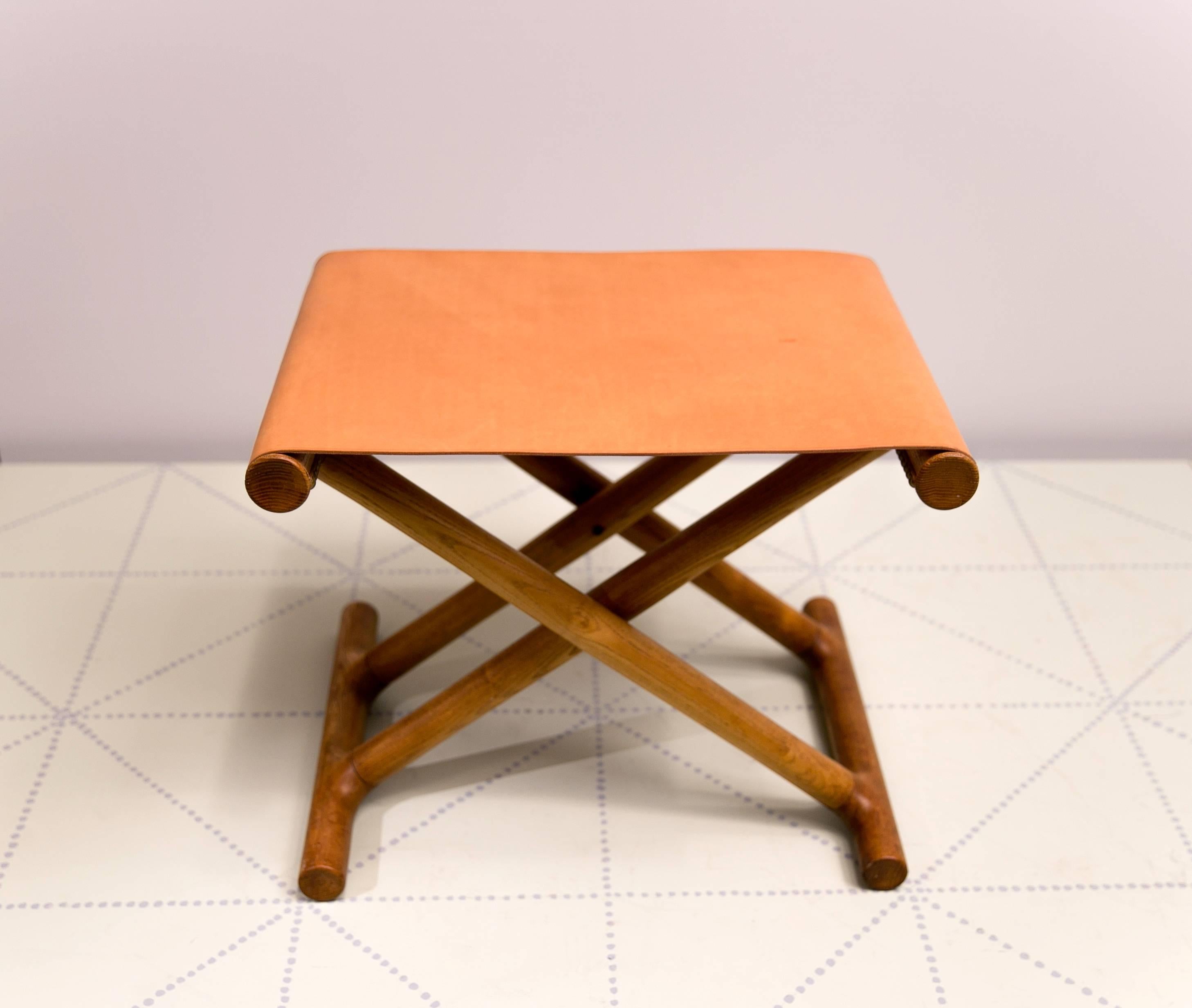 Mogens Lassen's, 1946 Egyptian Folding Stool in Ash and Natural Leather. Presented in 1946 at the Copenhagen cabinetmakers’ Guild Exhibition on the stand of cabinetmaker Jørgen Wolff’s Møbelsnedkeri, this exquisite stool is possibly unique. It fits