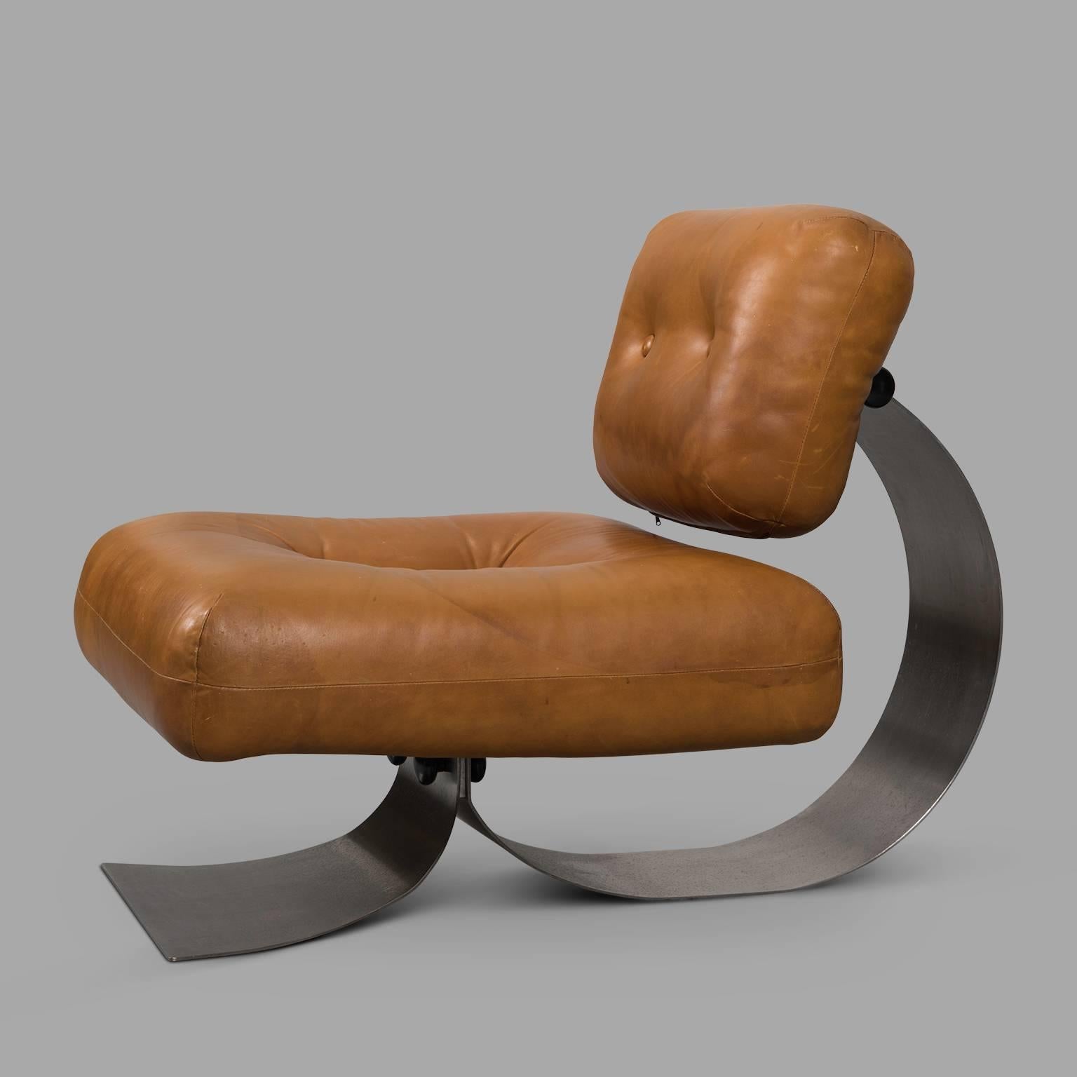 Original Brazilia armchair, circa 1970, by Oscar Niemeyer (1907-2012); mobilier International (editor). Structure formed of two stainless steel angled blades joining under the seat, a trapezoidal shape front frame element, the other element forms