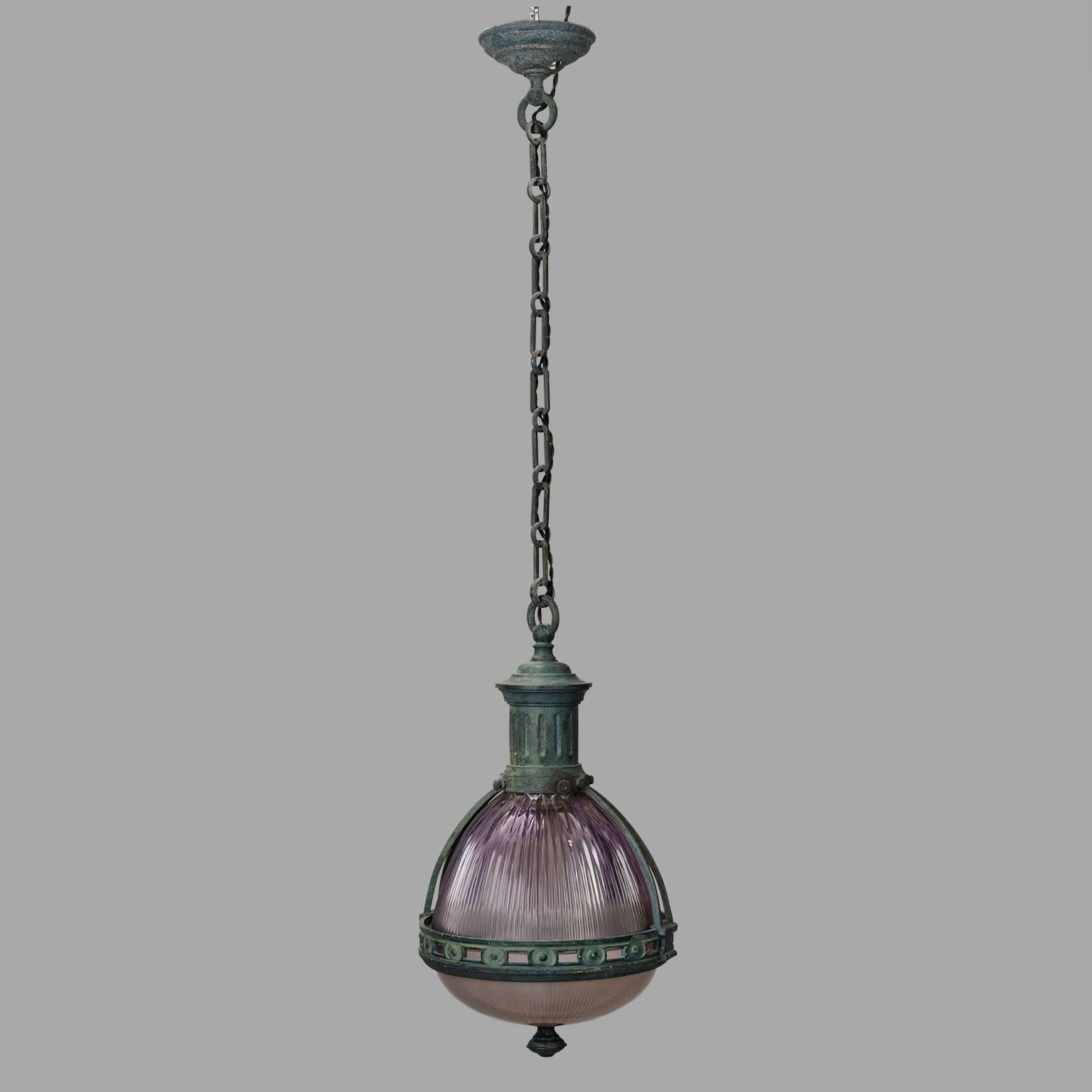 Original light violet tainted glass. The bronze is enhanced with a beautiful green gray patina. Contemporary wiring.