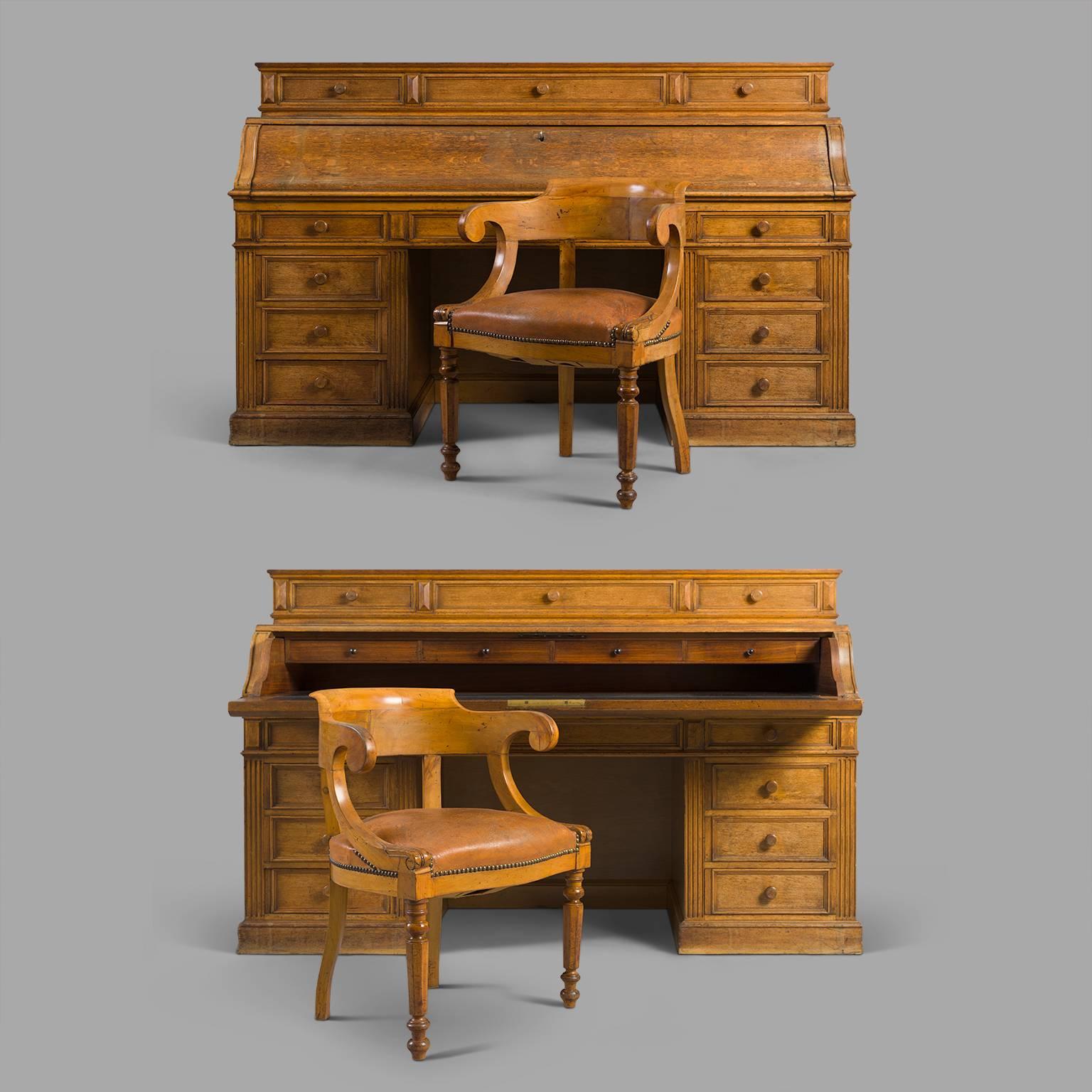 Oak desks, interior drawers and plate in rosewood veneer, leather blotter.
When opening, or closing the plate, a mechanism system allows locking or unlocking upper and lower drawers. Walnut armchairs with leather seating.
 
Some wear consistent