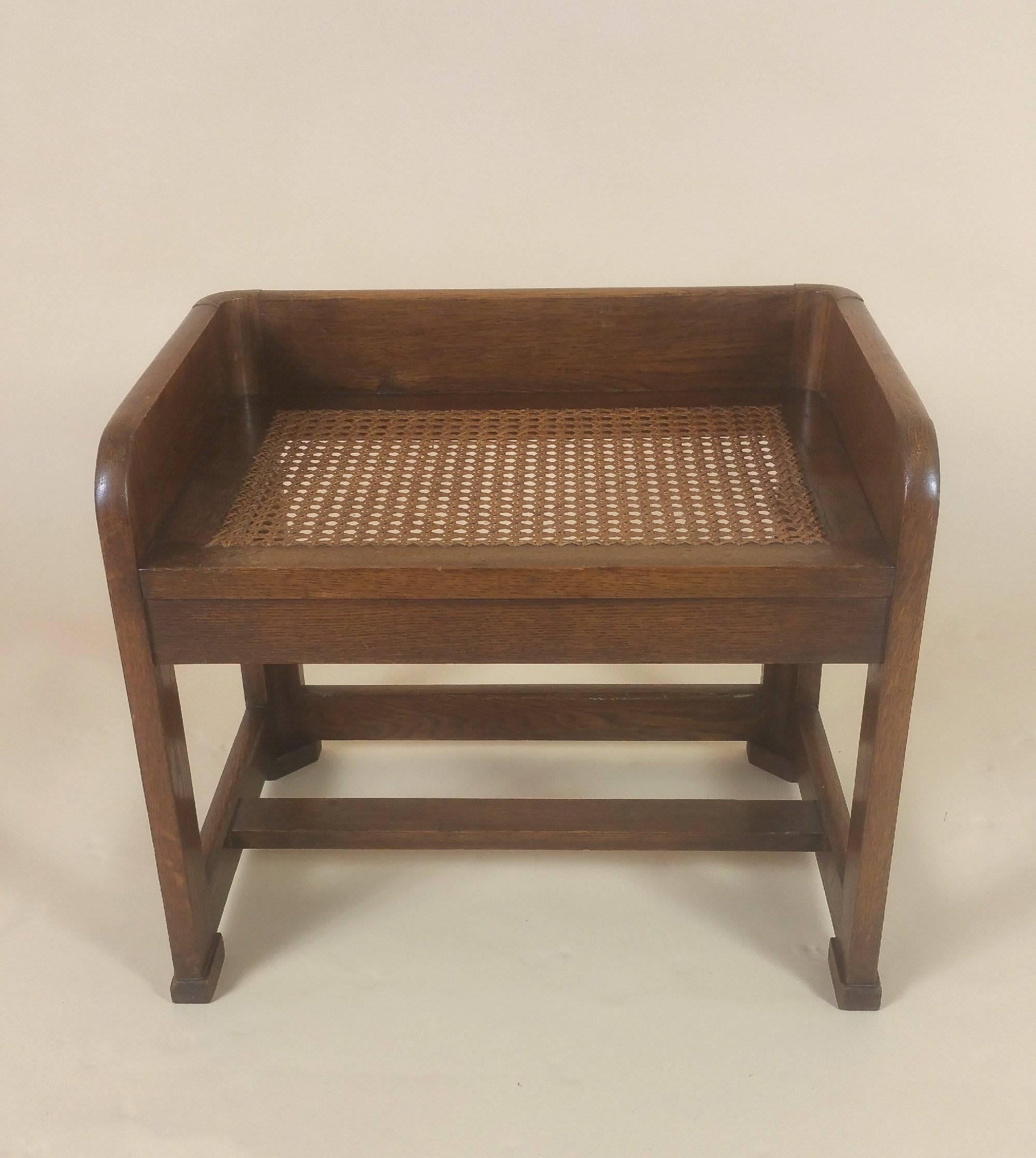 This unusual and very attractive rectangular Art Deco shaped stool is made of Oak and features a Bergere sectioned seat. The Stool has a high gallery back and sides with an H frame stretcher base. It measures 20 in – 50.8 cm wide, 14 in – 35.5 cm