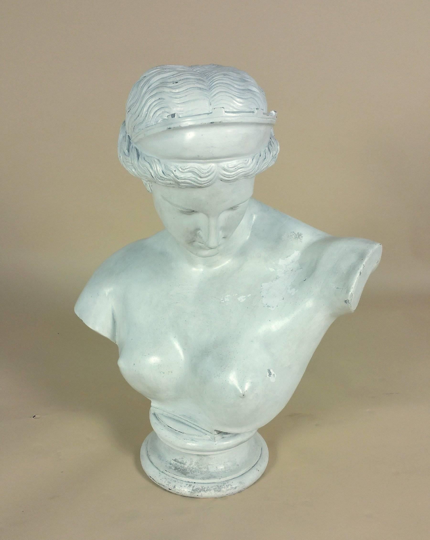 This exquisite and alluring plaster bust of Venus, after the antique, is late 19th century and very substantial in size. She has a wonderfully soft expression and is in original condition, with gentle wear and markings. The bust measures 20 ½ in –