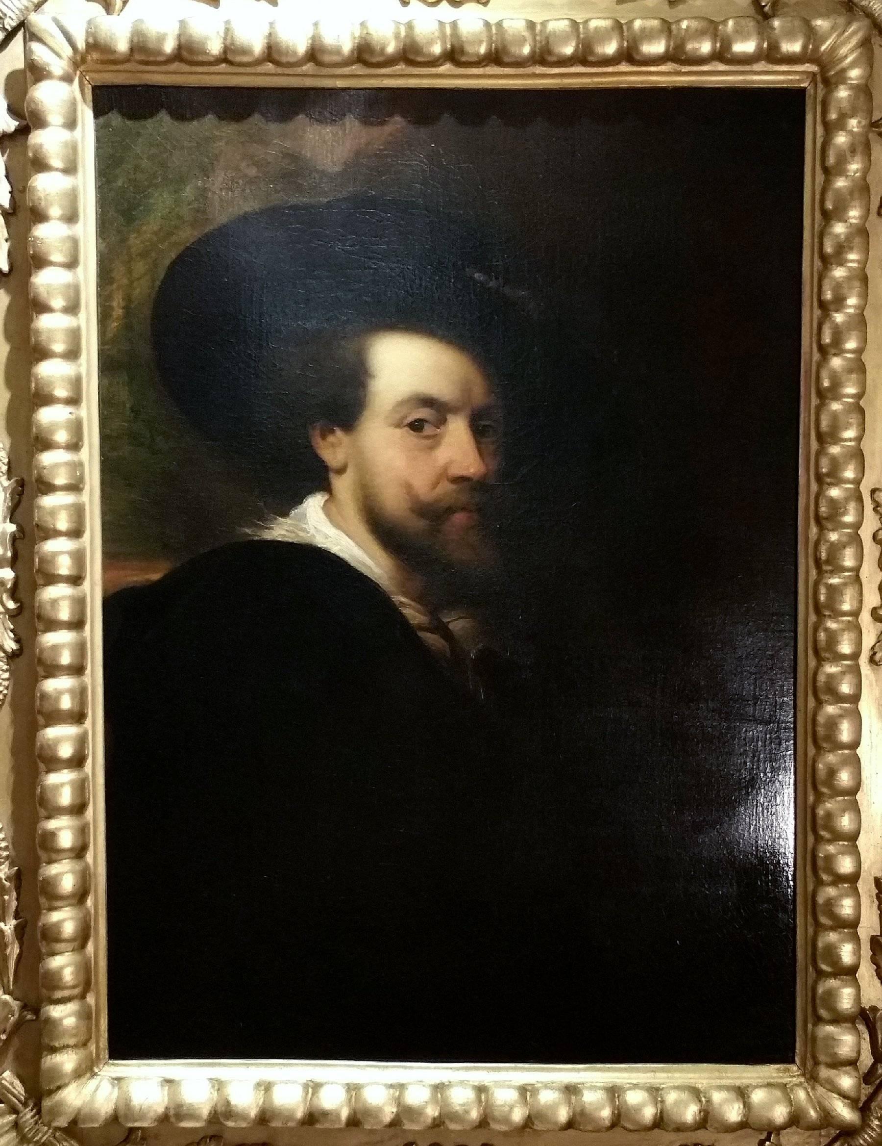 This superb mid-18th century oil on canvas depicts a noble gentleman, after Van Dyck. The portrait sits in an ornate carved giltwood frame, with corner shell designs and a rope border around the inside border. The painting inclusive of the frame