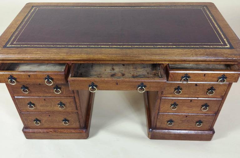 Victorian Gothic Oak NineDrawer Pedestal Desk with Leather Top For