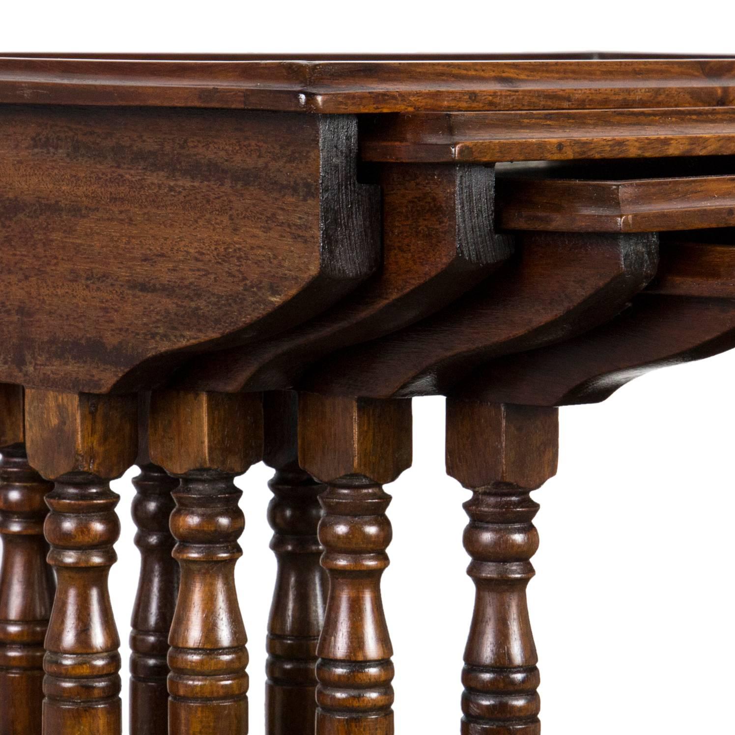 An unusual and fine quality Anglo-Indian quartetto nest of tables, in padouk or similar hardwood, the top table having an eye-catching mother-of-pearl inlaid motif. Each table is raised on elegant ring turned legs united by a stretcher at the rear.