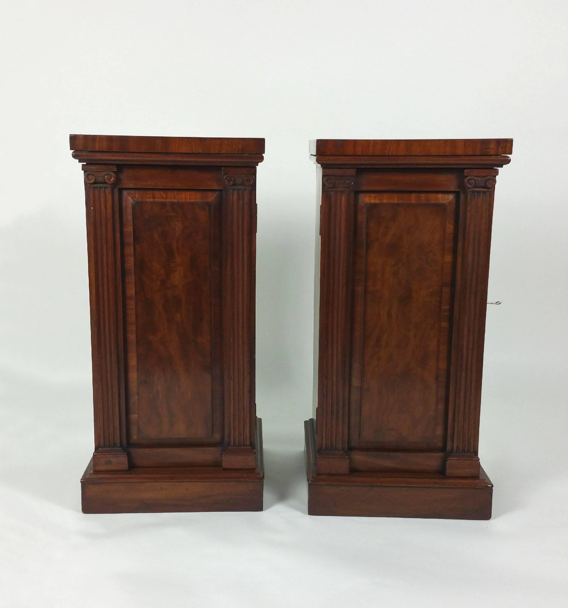 This very handsome and well-proportioned pair of early 19th century mahogany pedestals feature a lovely Greek Revival carved pilaster design and are stamped James Winter, Wardour Street, London – A very well-known cabinet maker of the period. Each