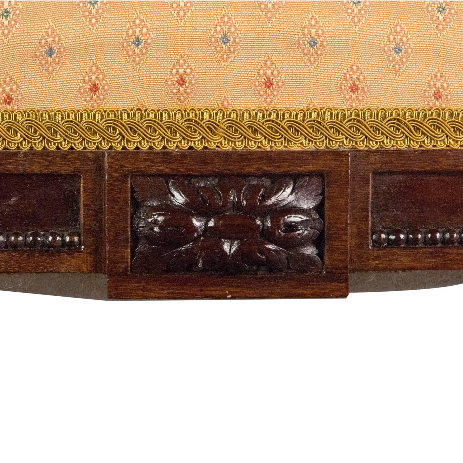 A quite exquisite and superb quality pair of 19th century rosewood stools, having original sprung upholstered seats above a frieze with anthemion carving (all sides match), and raised on elegant turned and fluted tapering legs with original castors.