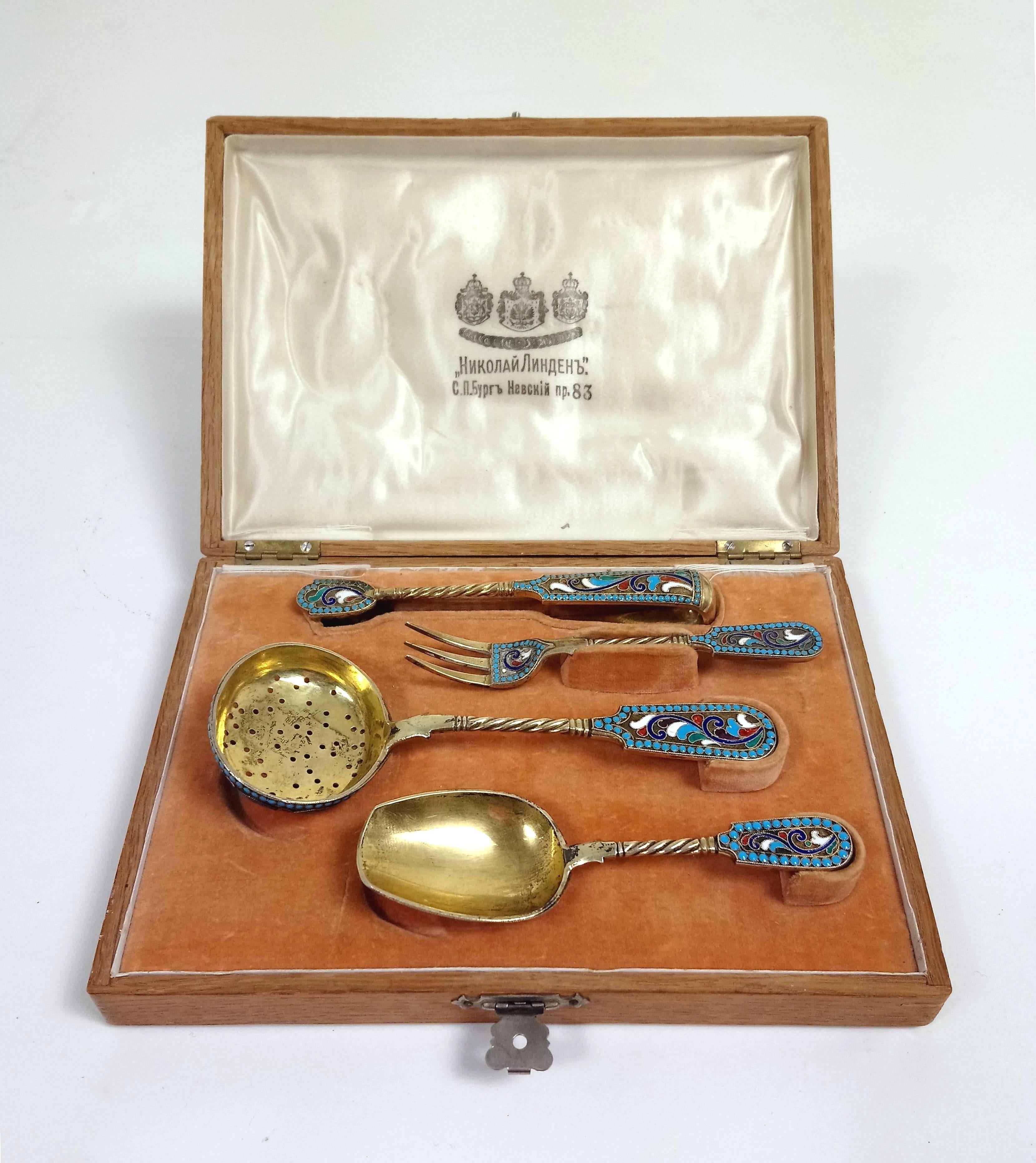 This exquisitely designed and beautifully crafted late 19th century silver gilt and Champlevé enamel tea serving set is complete in its original fitted box. It measures 8 in – 20.3 cm wide, 5 3/4 in – 14.6 cm deep and 2 in – 5 cm in height. The set
