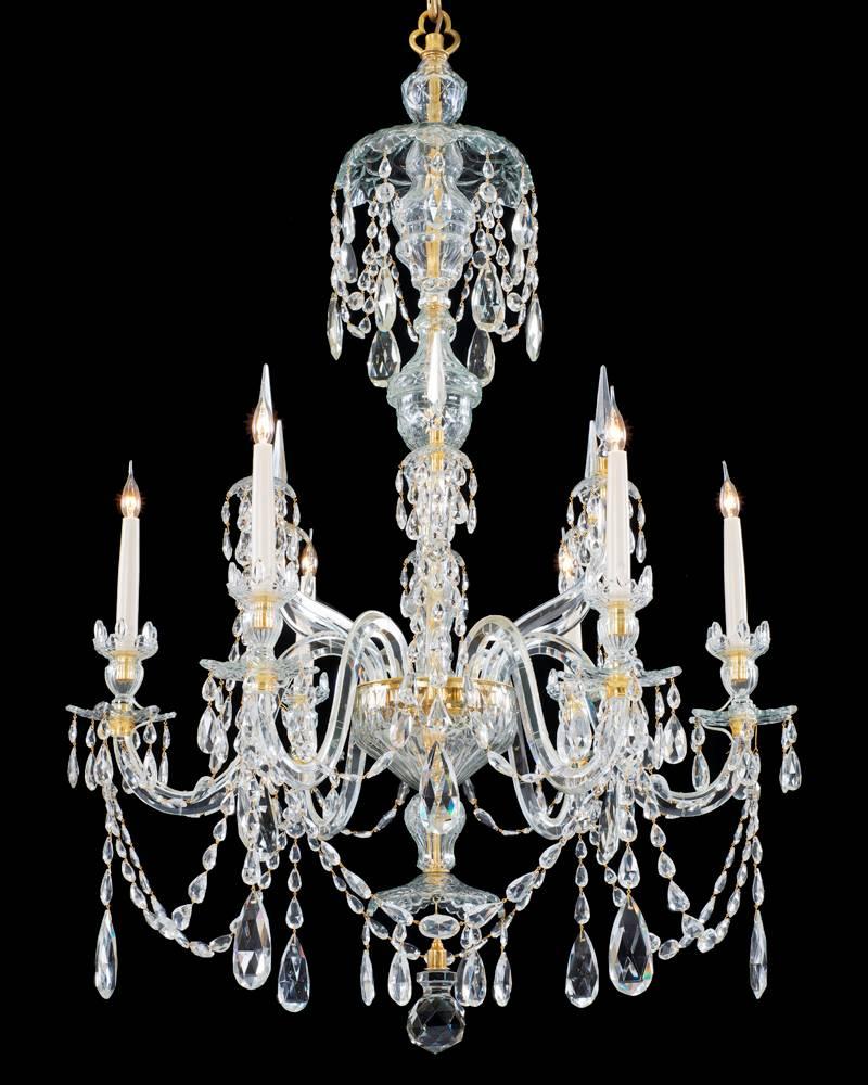 A fine pair of six-light ormolu-mounted cut-glass chandeliers the baluster shaped shaft centered by an urn shaped shaft piece this piece surmounted with a drop hung canopy the receiver plate supporting six candle arms these arm with van dyke drip