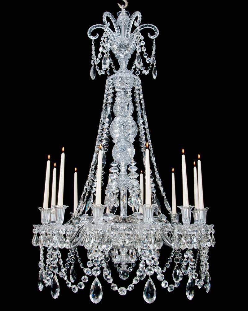 A fine quality pair of twelve-light cut-glass and silvered mounted chandeliers attributed to F&C Osler the flat diamond cut baluster stem surmounted by six thumb cut drop hung Sheppard’s crooks terminating with a trumpet shaped top piece the flat