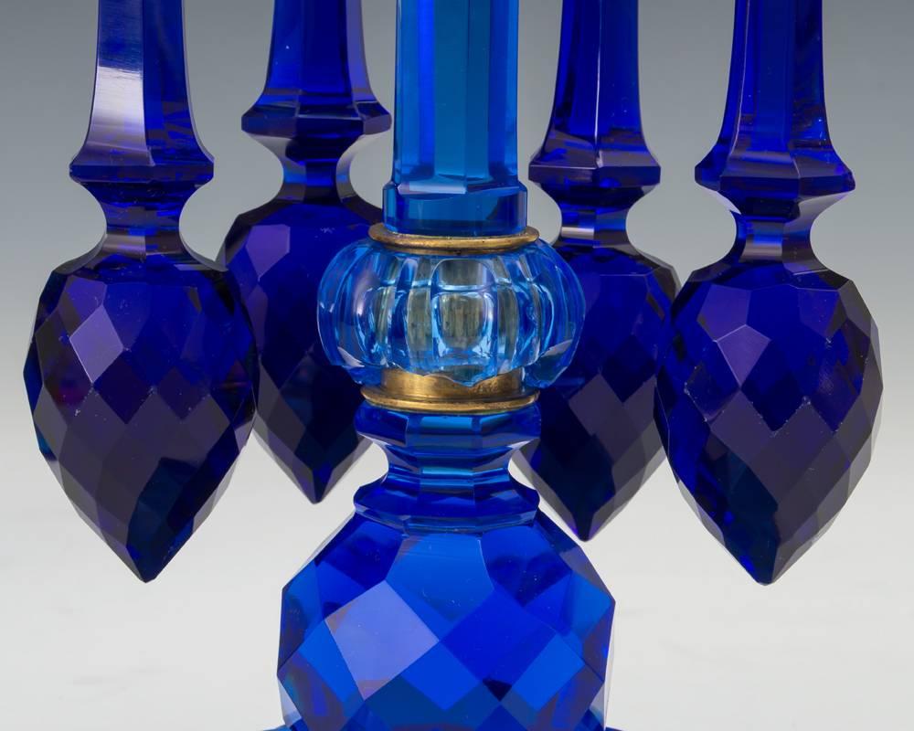 A highly unusual pair of blue cut-glass candlesticks of the finest quality by F&C Osler hung with there rare tulip drops.
Sadly there is a chip to one collar please see image.