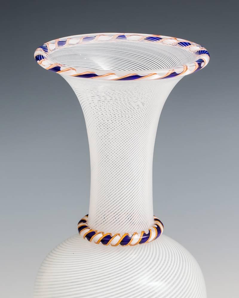Fine white spiral vase by Saint Louis unusually with blue and yellow rim.