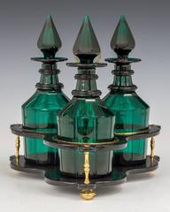 Set of Three Green Glass Victorian Decanters in Black Lacquer Stand