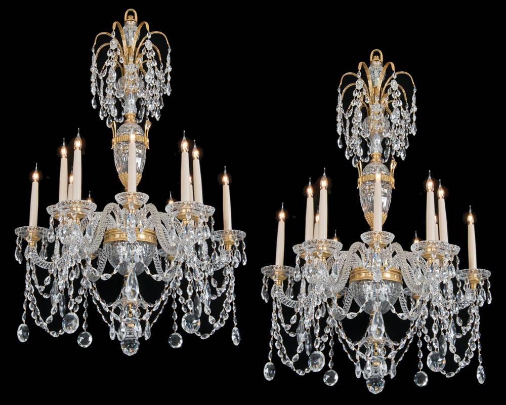 A fine quality pair of twelve-light chandeliers in the style of Perry & Co the ormolu-mounted and cut crystal shaft centred by an ormolu-mounted urn this surmounted with a double ormolu drop hung palm tree. The ormolu-mounted receiver plate