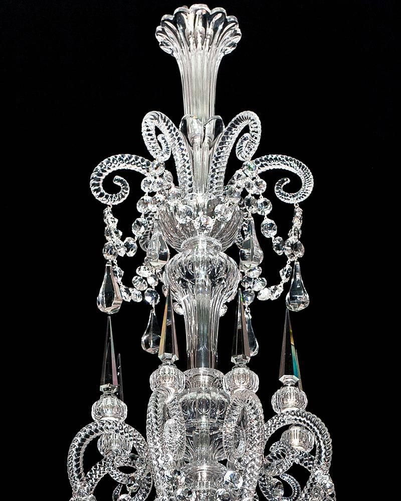 A fine quality eight-light cut-glass chandelier by F&C Osler of Birmingham the main baluster shaped stem centered by eight drop hung rope twist reverse crooks these with flute cut collars and six sided spires the stem terminating with small swaged