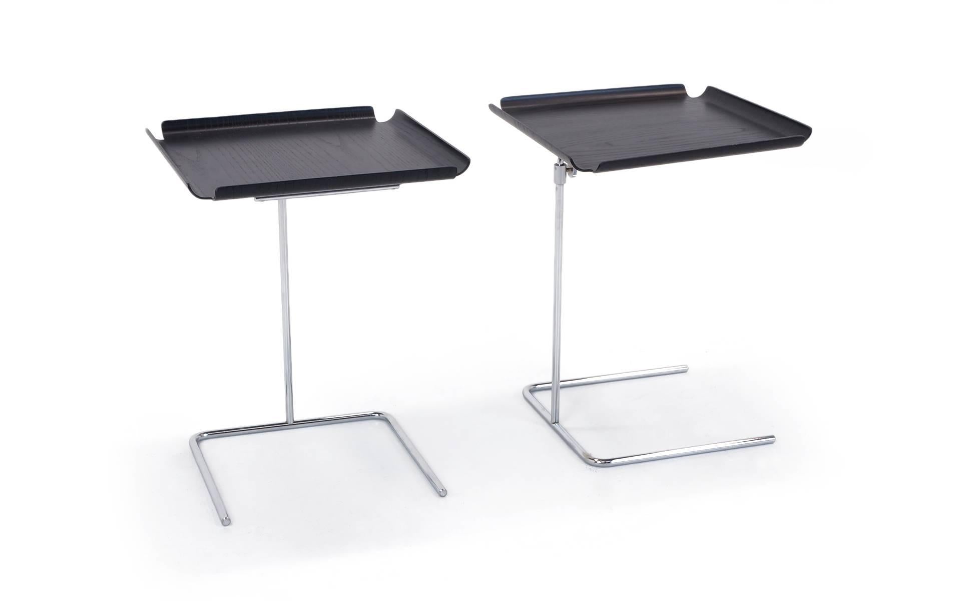 Pair of near mint condition George Nelson tray tables. Early Herman Miller reissue. Not the current Vitra production. Collapsed height is 19 in. Extended height is 33.5 in.