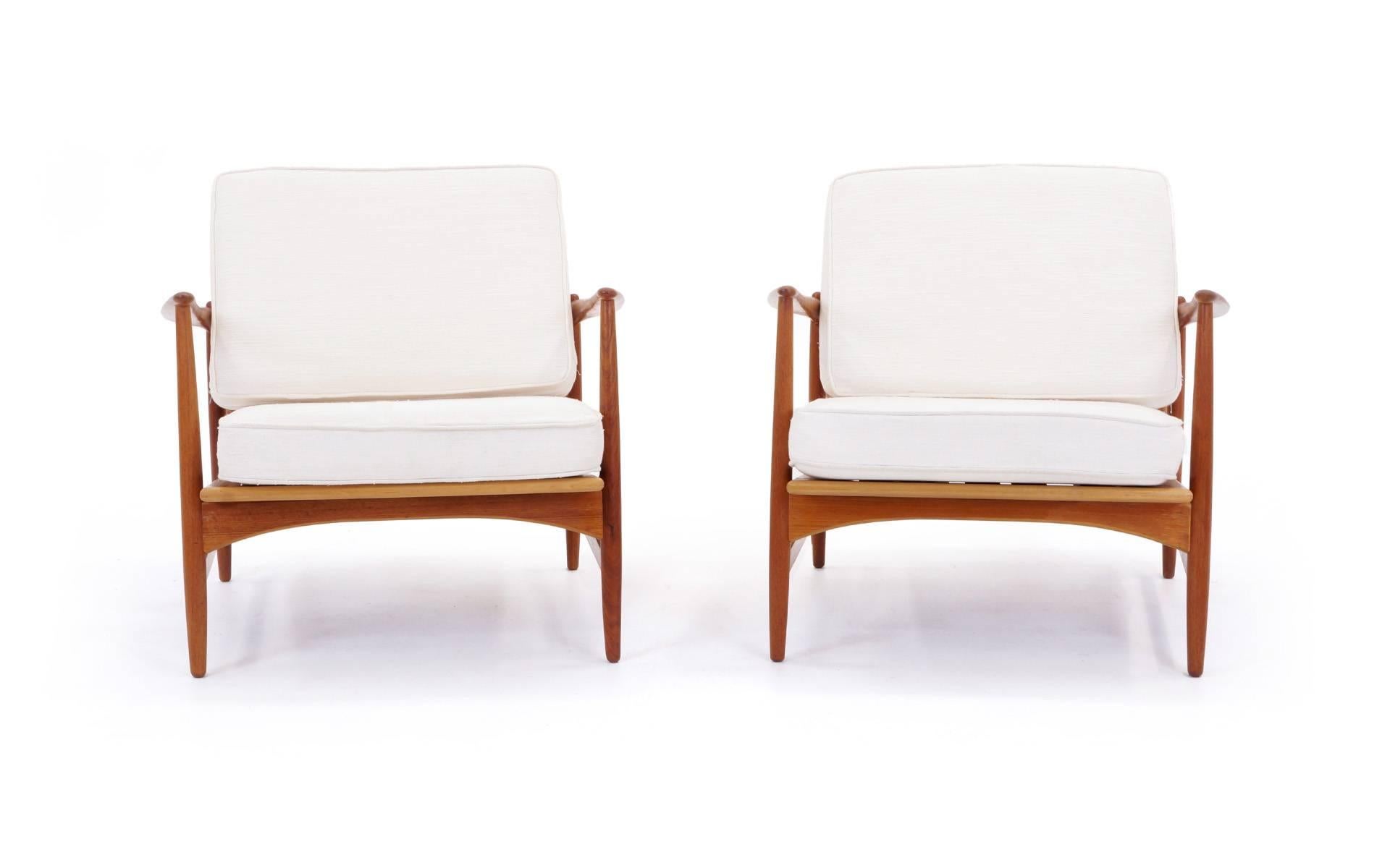 Pair of Kofod Larsen Lounge Chairs.  Teak frames in excellent condition.  Original cushions in good condition.  