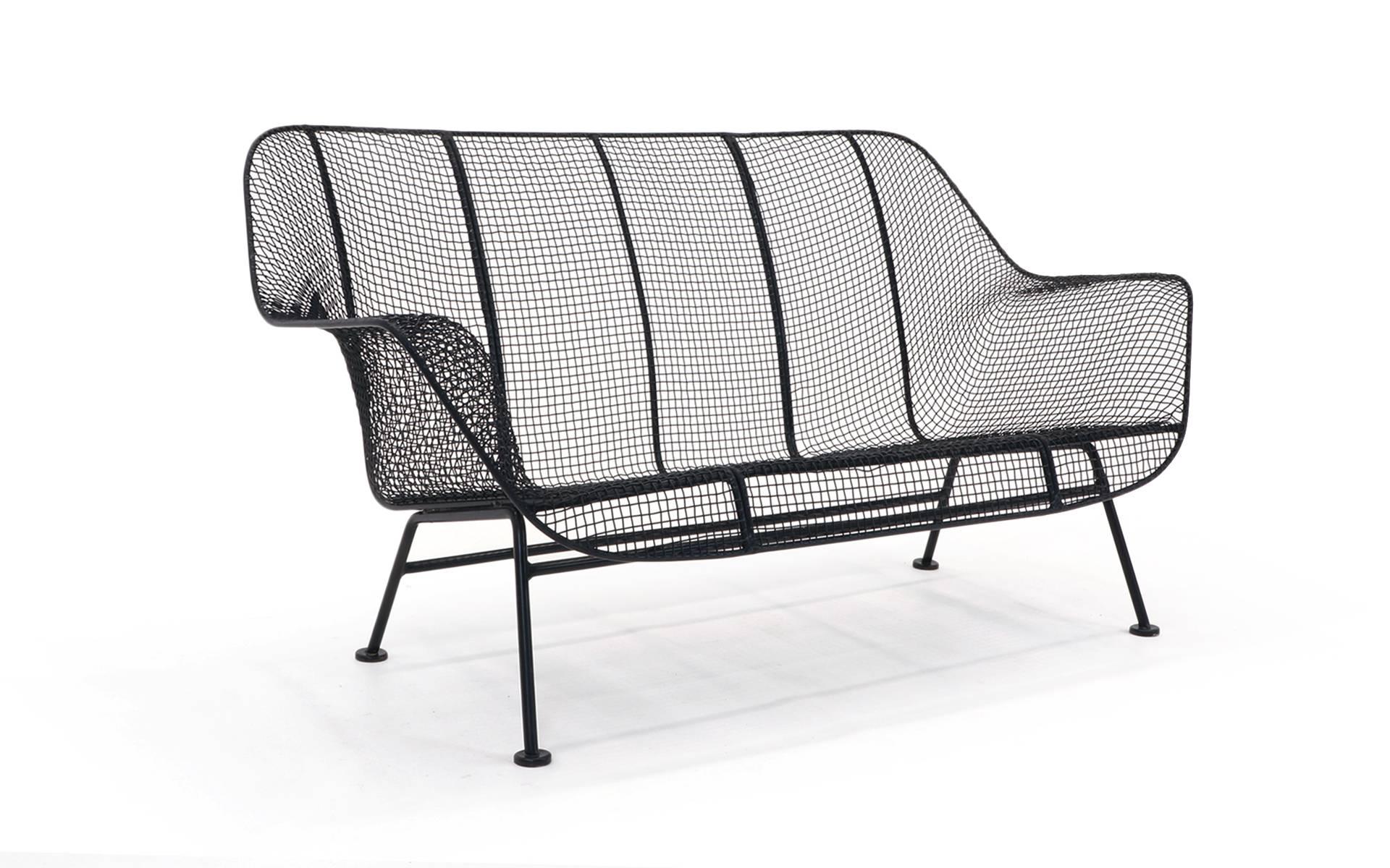 Russell Woodard "Sculptura" Settee.  Professionally media blasted and powder coated in a satin black finish.  This has never been outdoors since.  Structurally excellent as well.  