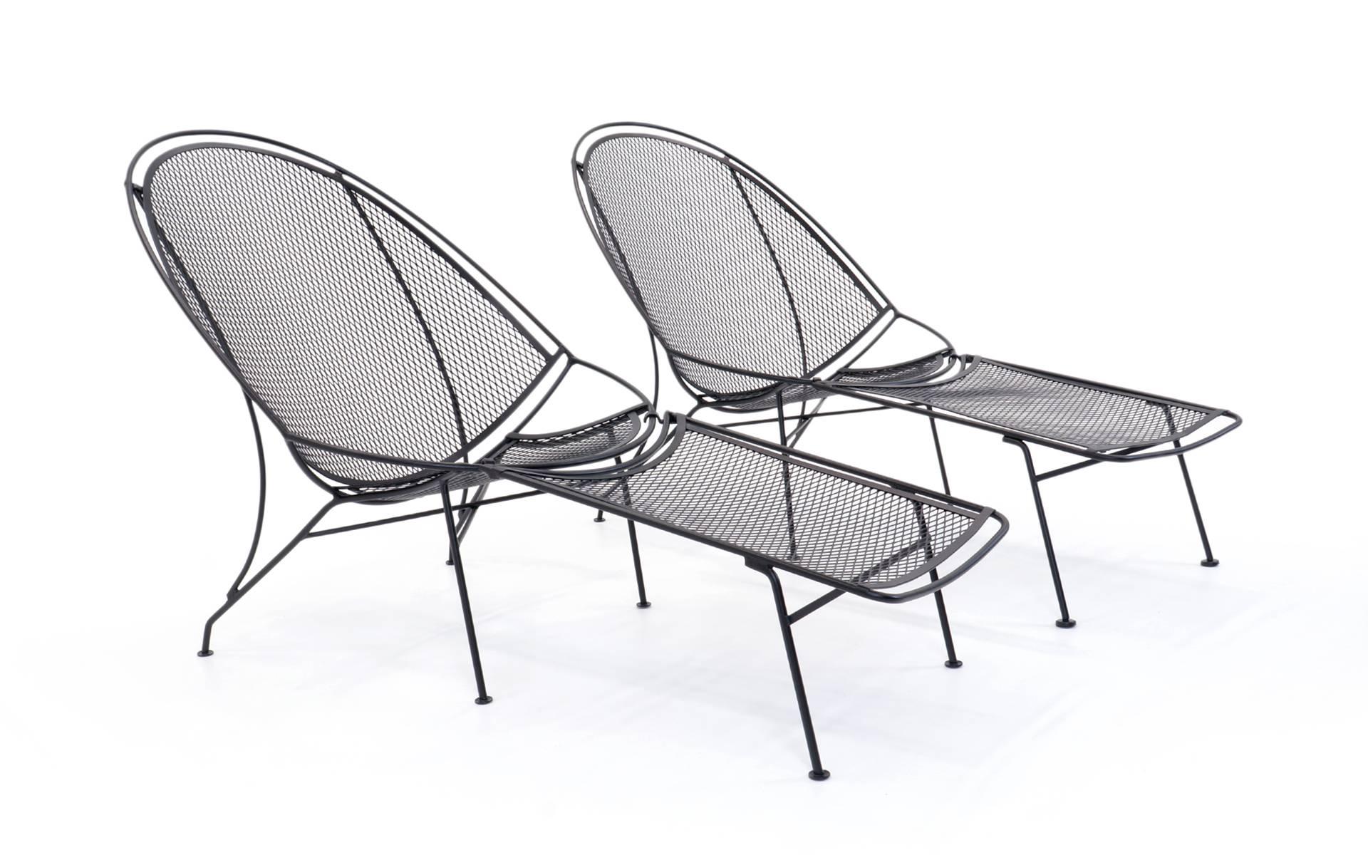 Pair of rare and desirable high back lounge chairs with removable footrest / ottoman, designed and made by the John Salterini Company, Brooklyn NY, 1965. These have been professionally media blasted and powder coated in a satin, slightly textured