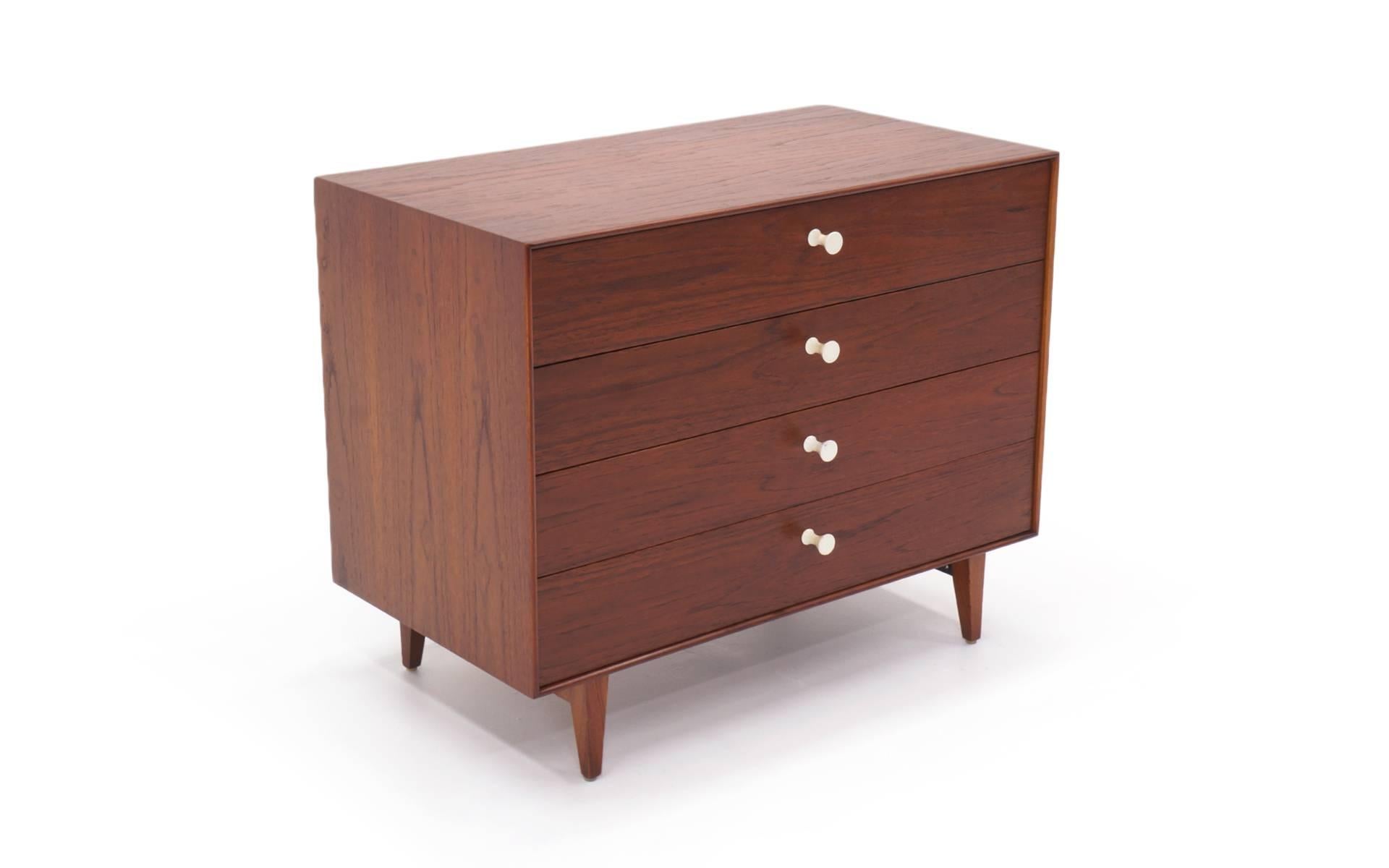 Rosewood thin edge cabinet designed by George Nelson for Herman Miller. Original porcelain pulls.