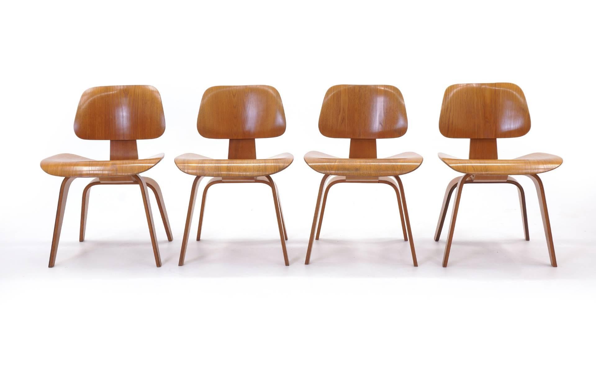 Beautiful set of four early original Eames dining chairs for Herman Miller. 