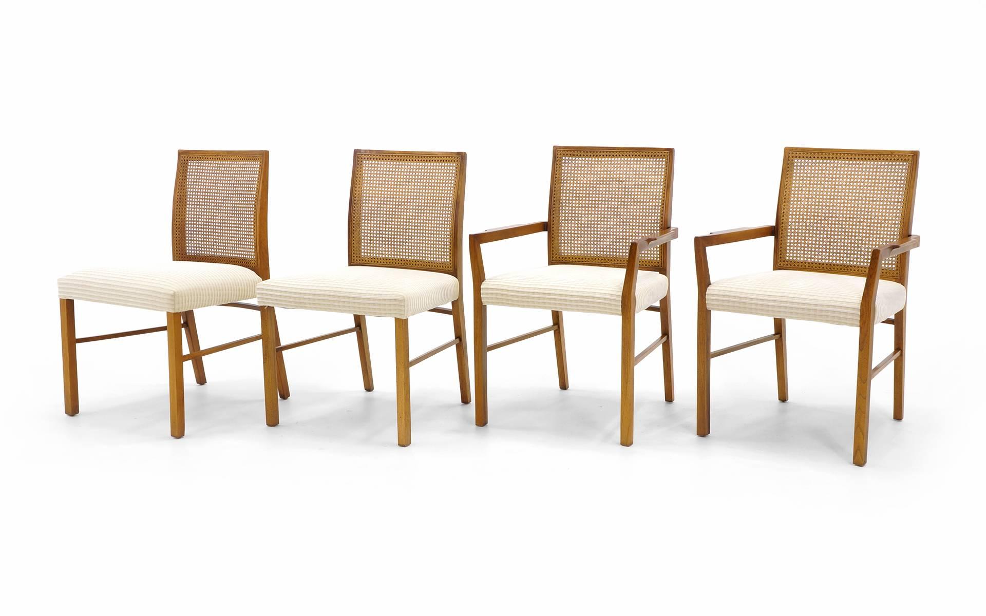 Excellent set of eight mahogany and cane dining chairs (two armchairs and six side chairs). Manufactured by founders, 1950s. Frames are all original and in excellent condition. Fabric is good, but would benefit from an upgrade. Dimensions are below.