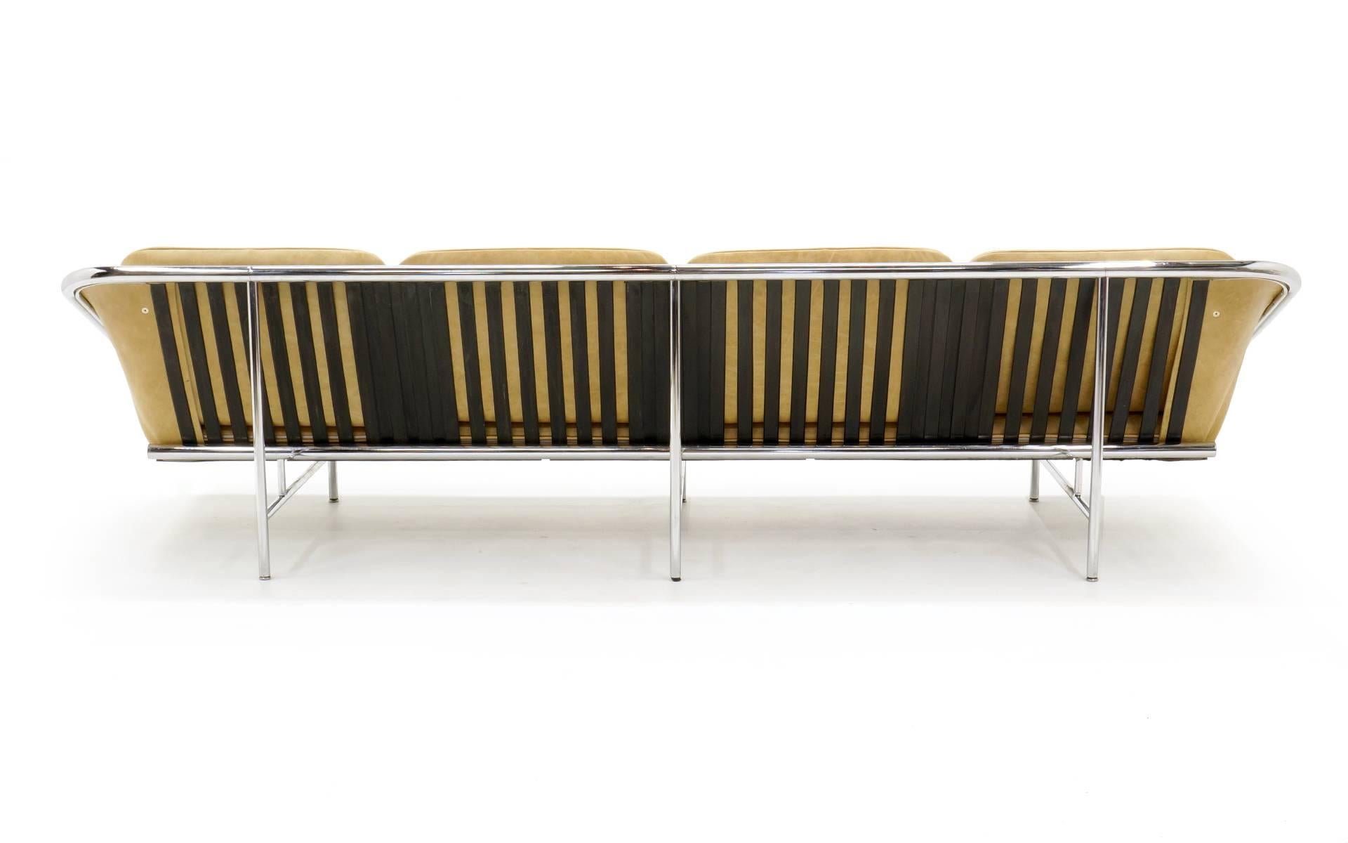 Rare four seat version of the George Nelson sling sofa manufactured by Herman Miller. Beautifully reupholstered in tan leather. The original tubular chrome frame is in excellent condition with stabilized wear to the chrome finish on the underside