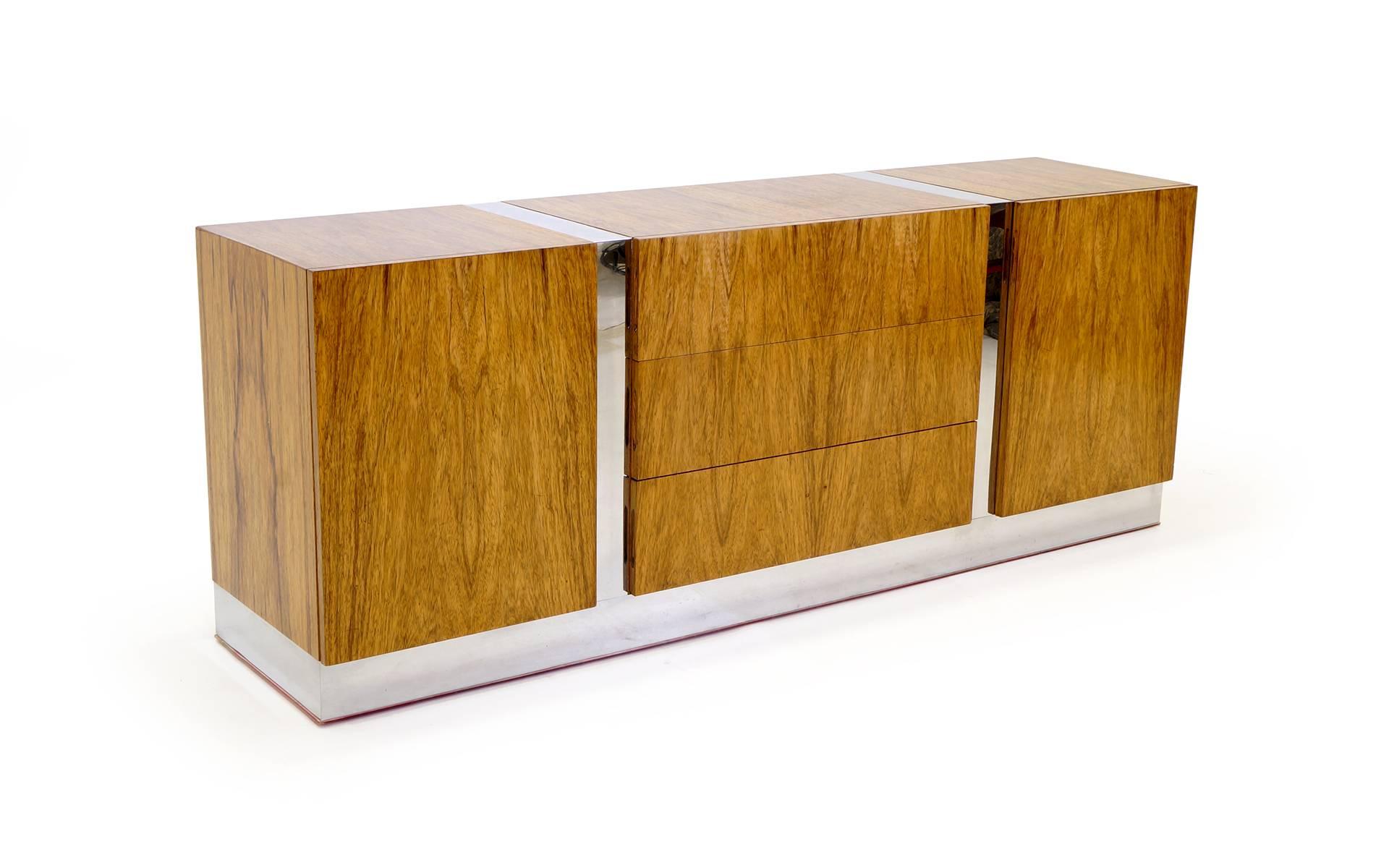 Exceptional bleached Brazilian rosewood credenza / dresser with chrome base and accents designed by Milo Baughman. See our companion nightstand / side table and queen headboard. All in rare bleached Brazilian rosewood.