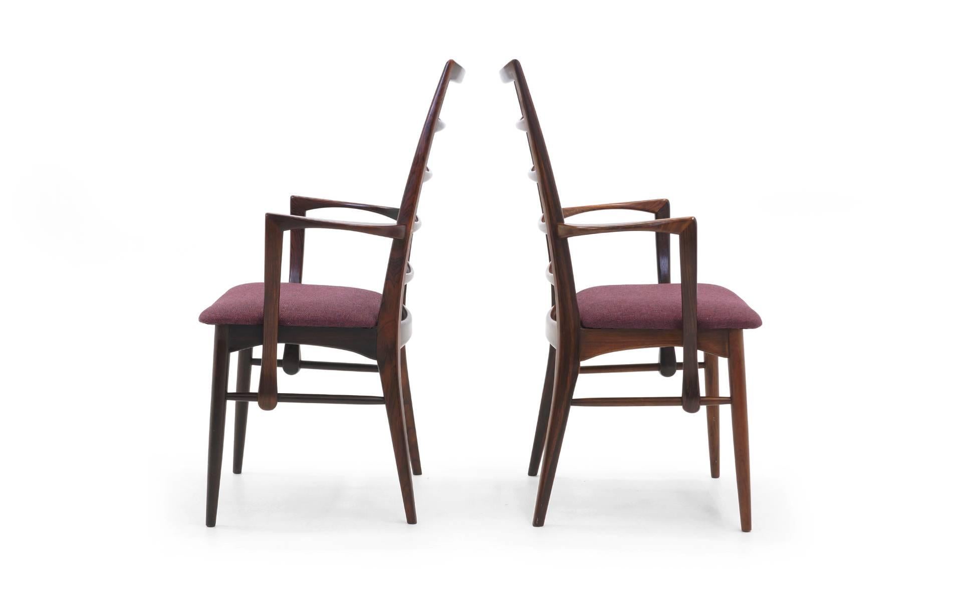 Pair of rosewood dining or side chairs designed by Niels Koefoed. Great set to add as captions chairs to an existing set of dining chairs. Rosewood is excellent. Fabric is good, but will likely want to update.