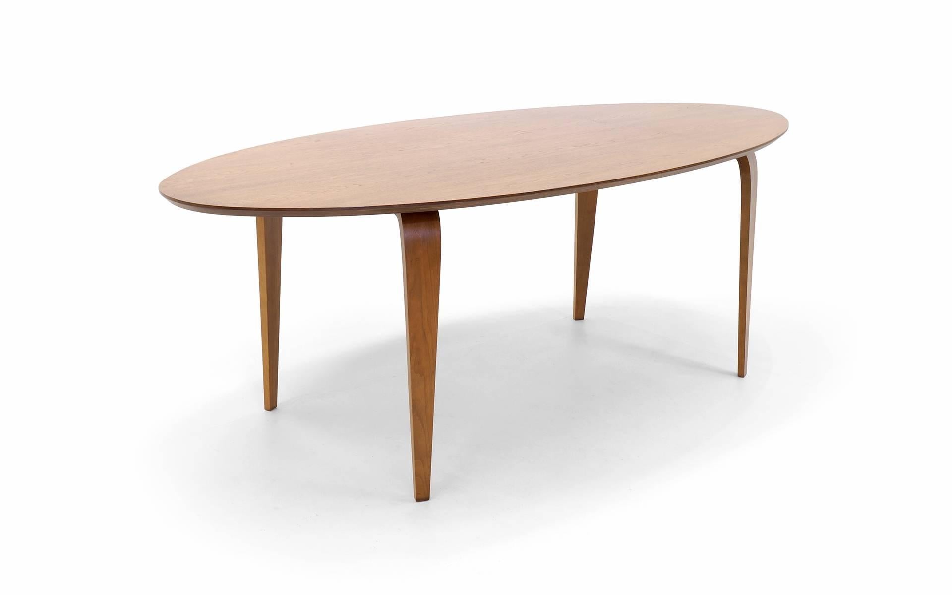 Oval dining table designed by Norman Cherner. Recent production in very good condition.