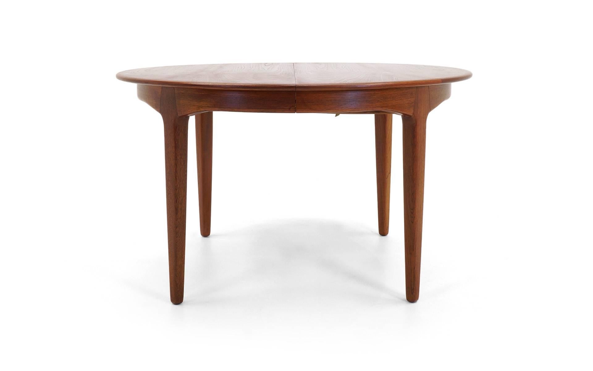 Outstanding combination of versatility and quality we have seen in a dining table. The Teak wood is in excellent condition. Begins 48" round and has four 20" leaves so extends to 10 1/2 feet. And the leaves are skirted so you have a