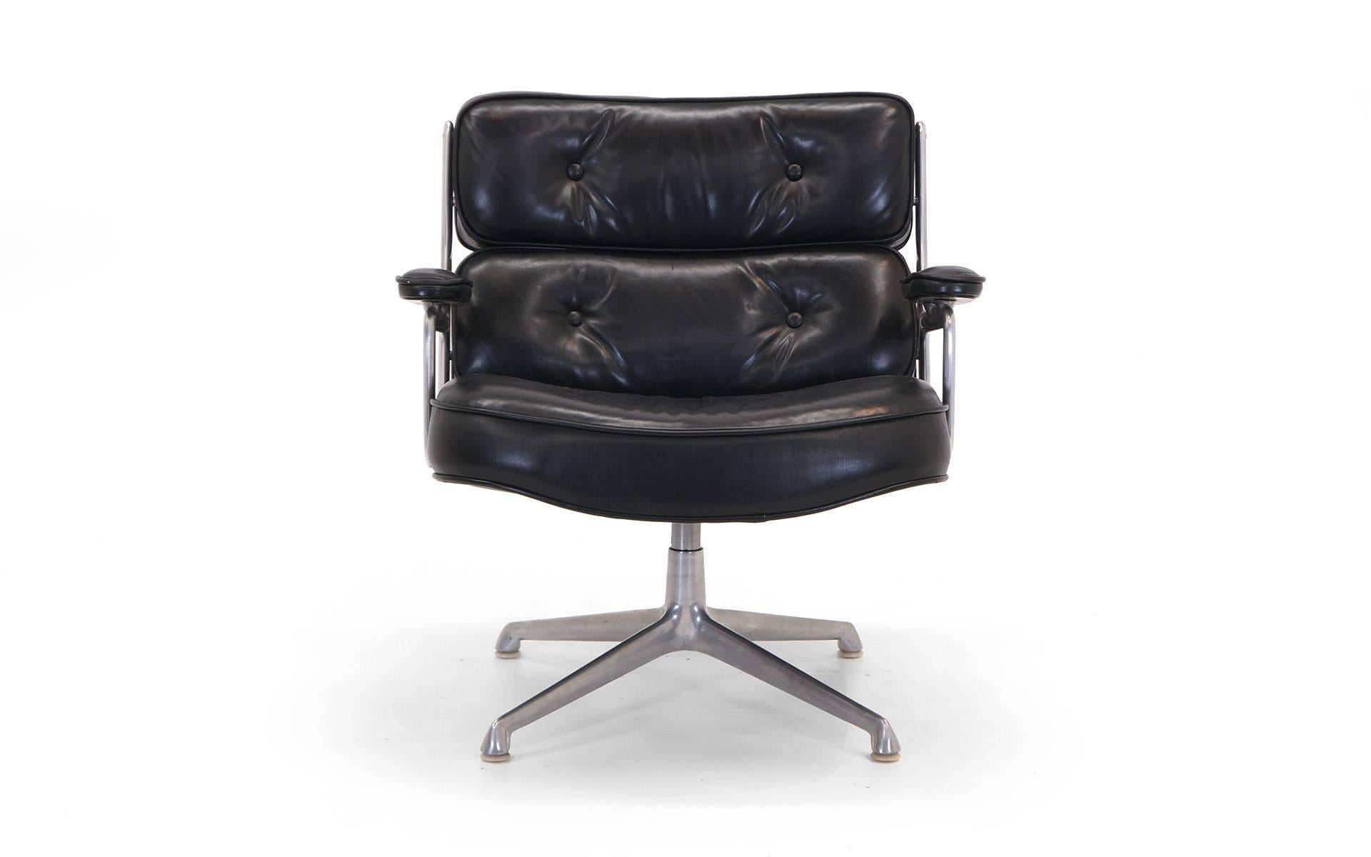 Early Charles and Ray Eames Time Life chair on the original lounge base. Original black leather in very good to excellent condition. Extremely comfortable with 360 degree swivel.