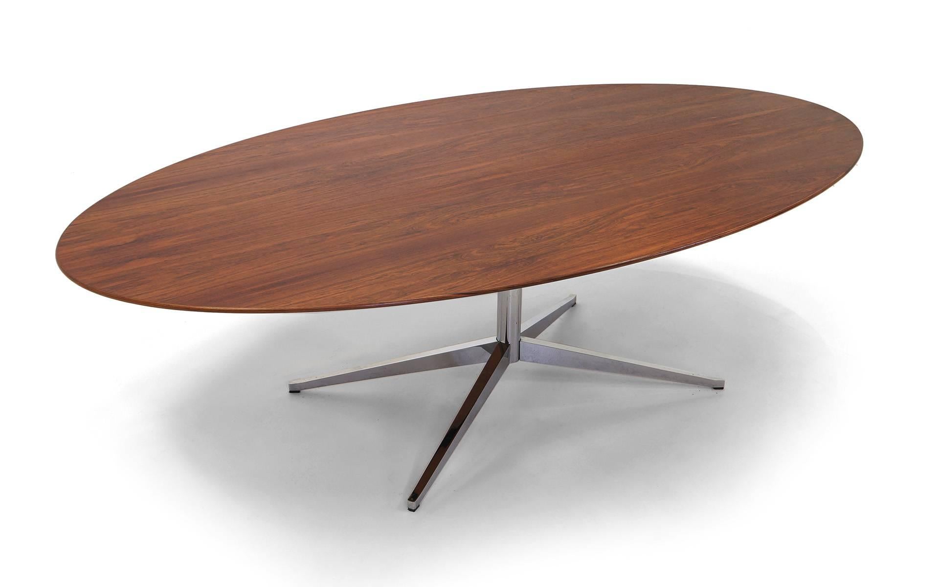 The figuring in this Brazilian rosewood Florence Knoll table is exceptional. Condition is excellent, over 8 feet long with the classic chromed steel base. Design, materials, and quality of build are as good as it gets. Signed with paper Knoll