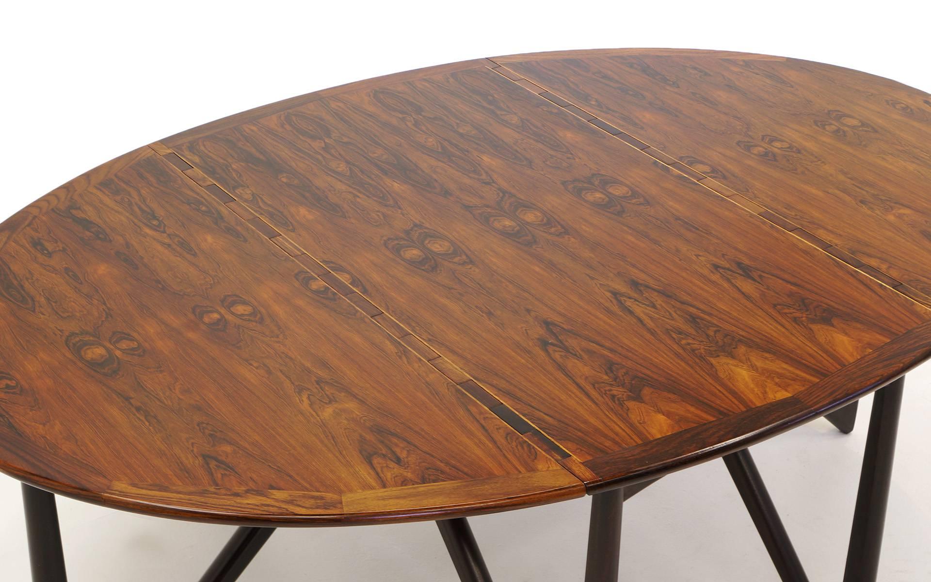 Kurt Ostervig gate leg dining table. Sculptural base, expertly refinished Brazilian rosewood top. A beautiful example of this design. Collapsed the table is 28.5 inches wide. Fully extended, 76.5 inches wide.