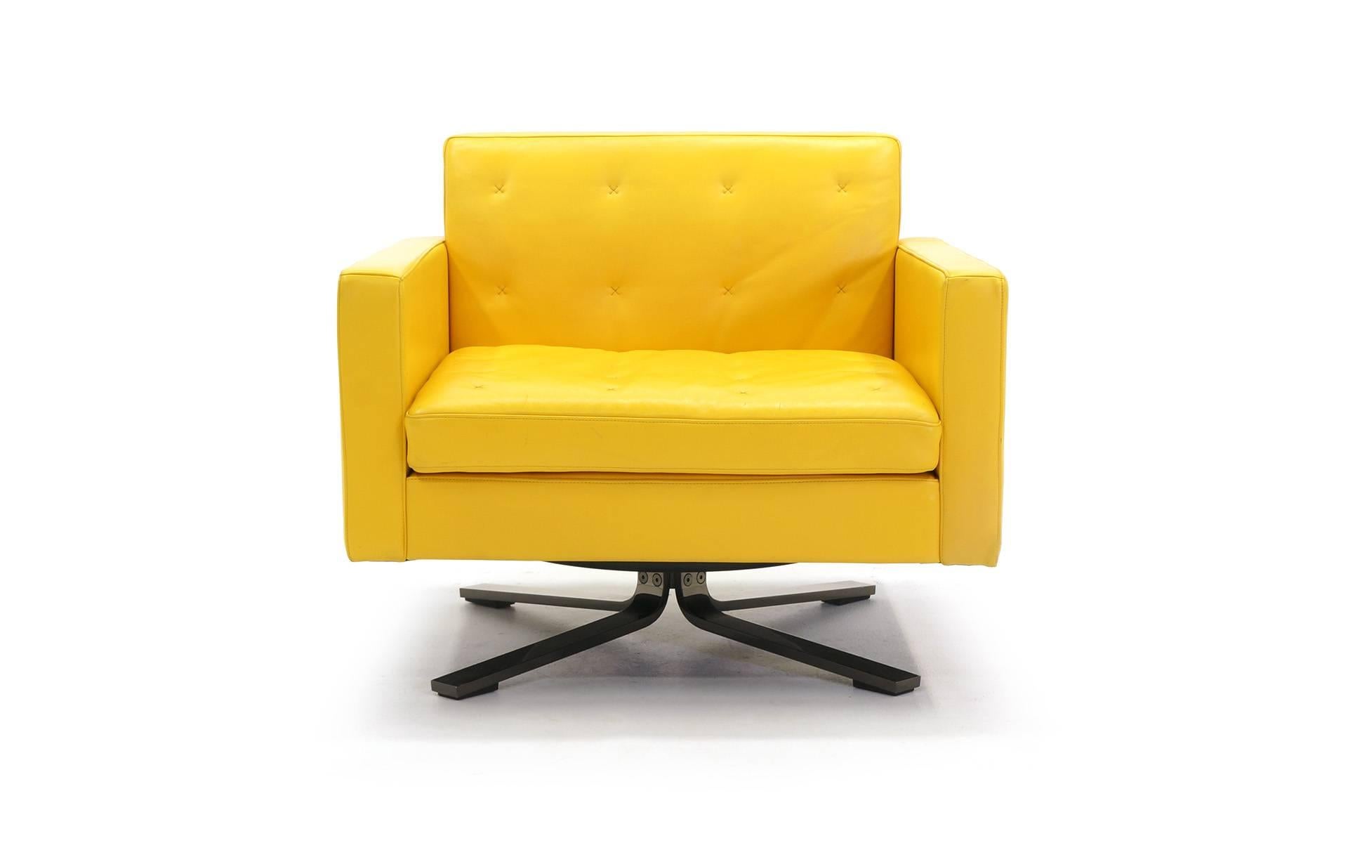 Leather and drawn steel swivel lounge chair designed by Jean-Marie Massaud  for Potrona Frau.  It is upholstered in Pelle Frau® yellow leather.  The delicate 'X' motif is hand-sewn with contrast stitching (see photos).  The swivel is a 