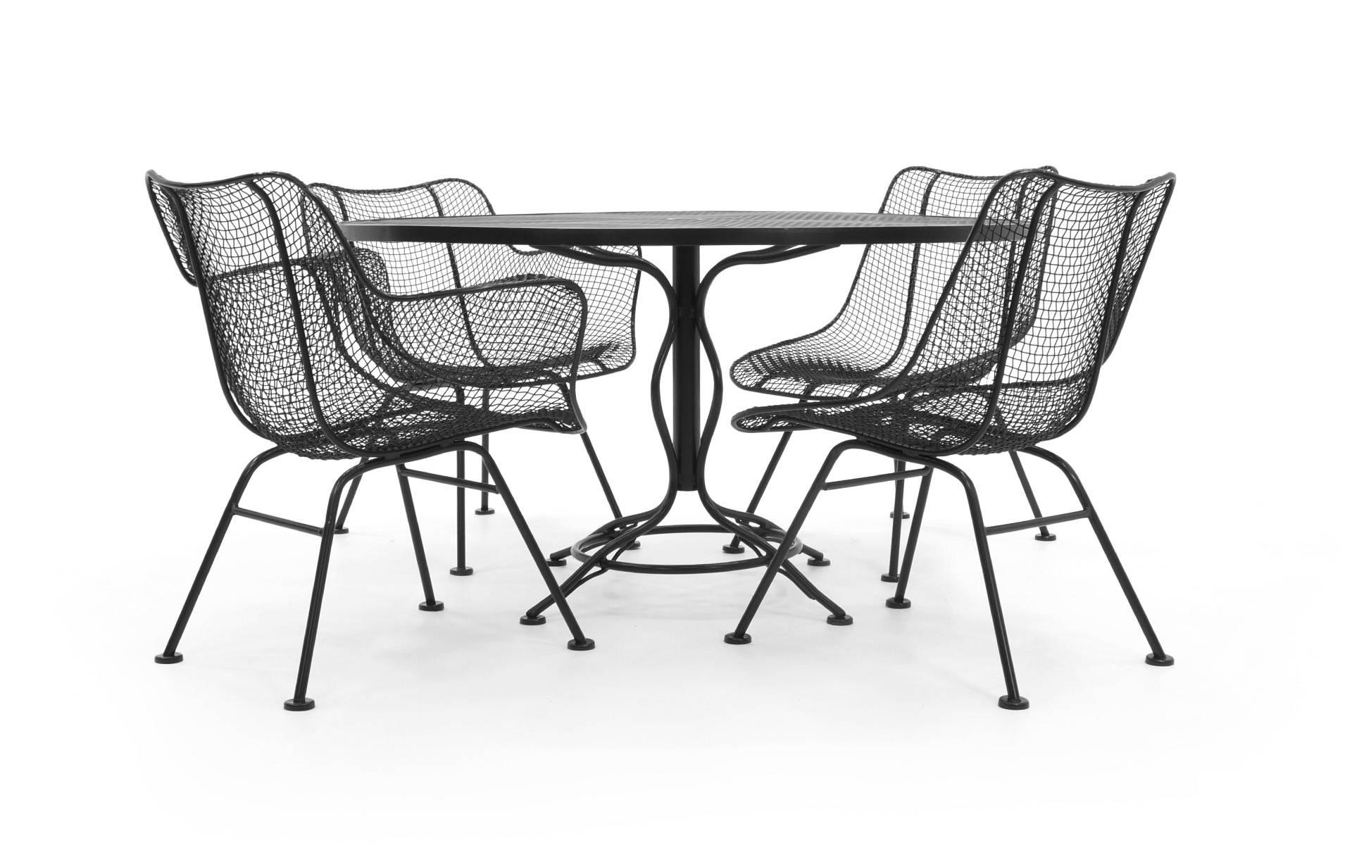 Not your typical dining set height Russell Woodard sculptura table and woven wire chairs. This is a unique and very comfortable lounge height table and chairs. Note the dimensions. Perfect for the pool, patio, outdoor or indoors. Professionally