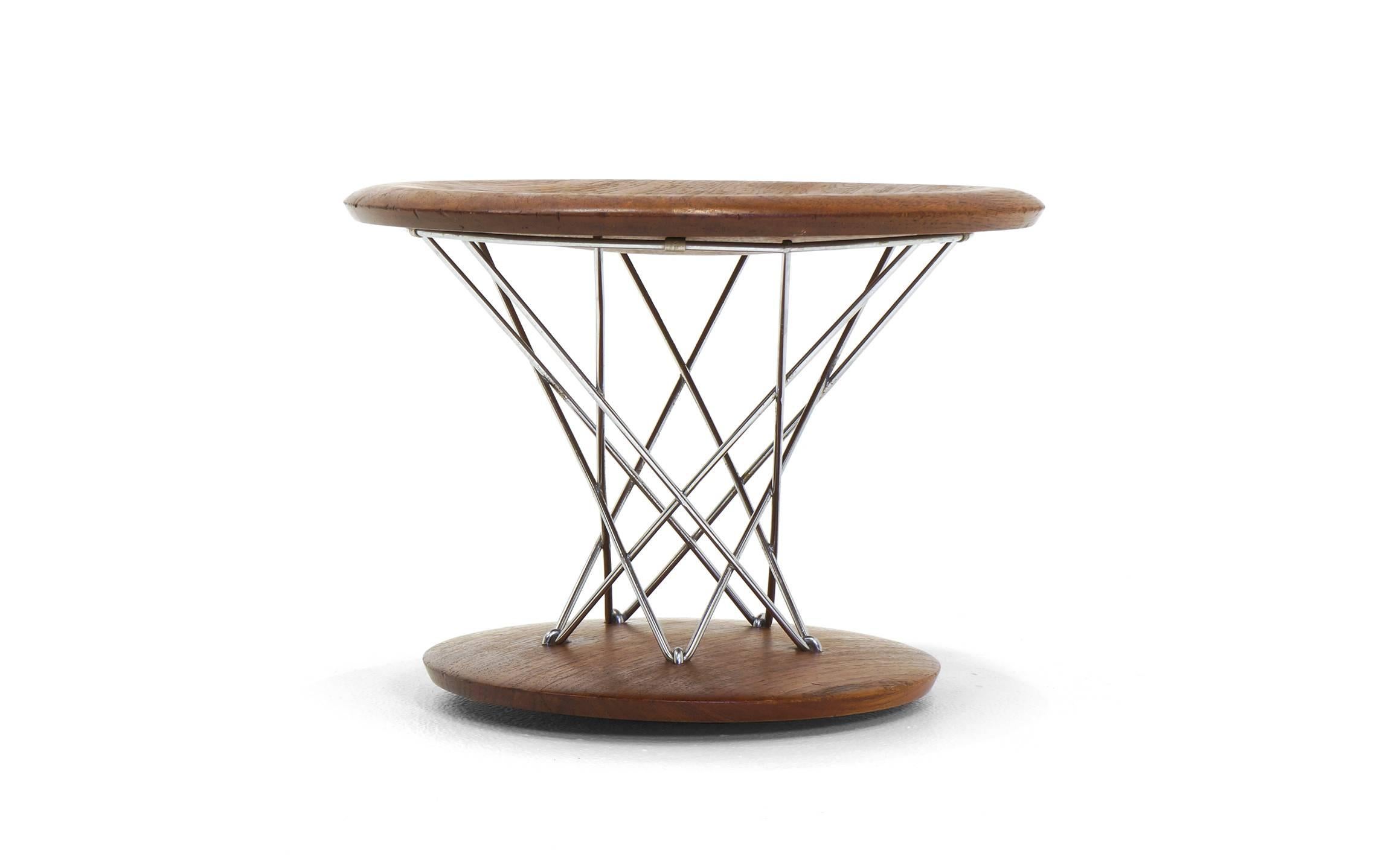 Beautiful, early, original, model 85-T, Noguchi rocking stool in solid walnut.