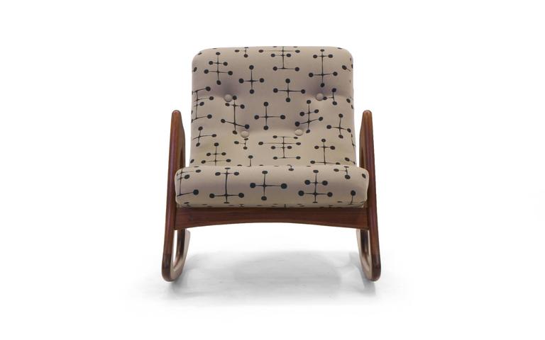 Adrian Pearsall for Craft Associates rocker. Expertly refinished walnut frame and reupholstered in Charles and Ray Eames design large dot pattern fabric manufactured by Maharam.