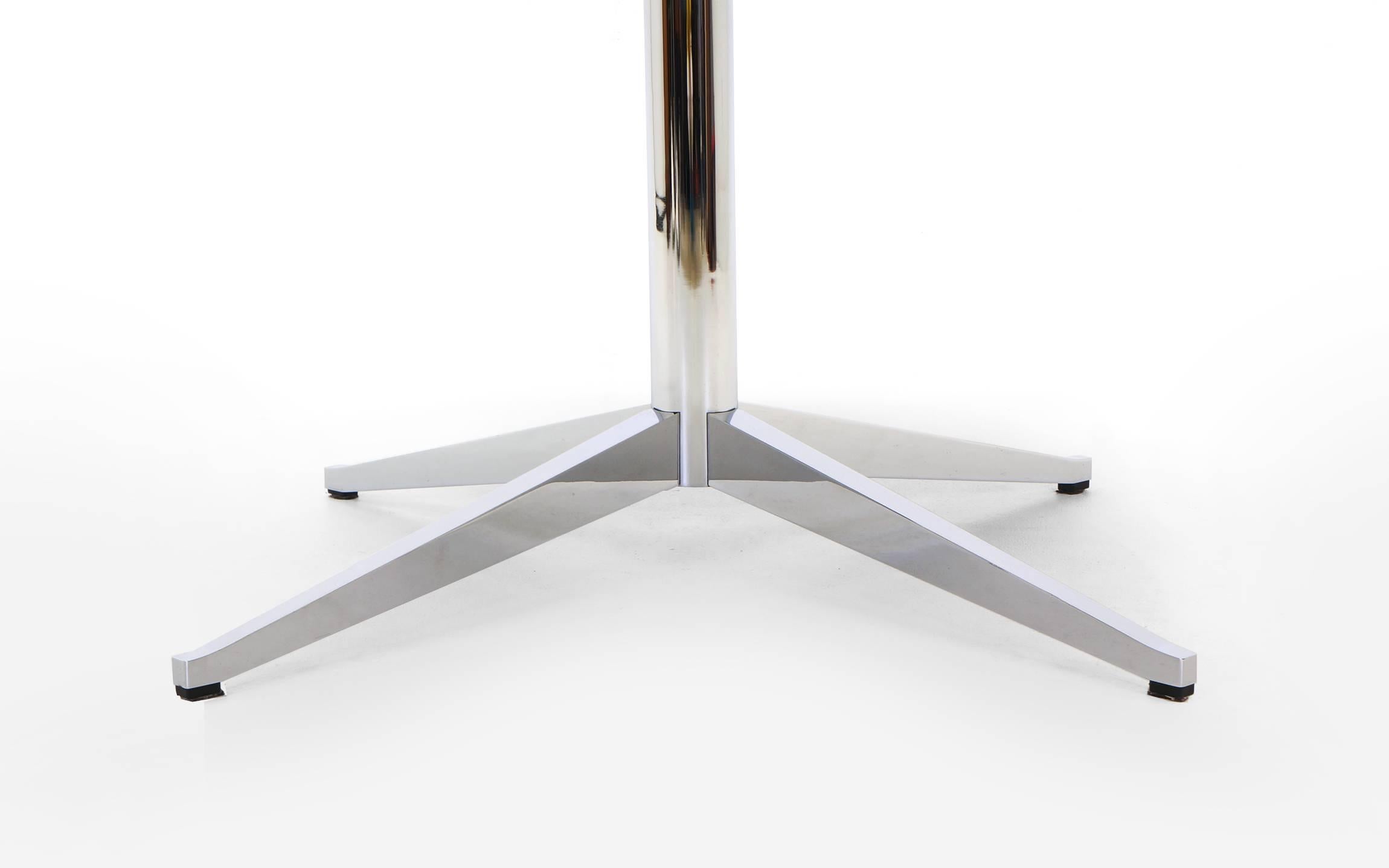 Stunning Florence Knoll polished coated nero marquina marble top table with heavy chromed steel base. The marble top has a deep bevel on the underside giving the substantial marble an elegant, lighter look. Photos can't do this table justice.