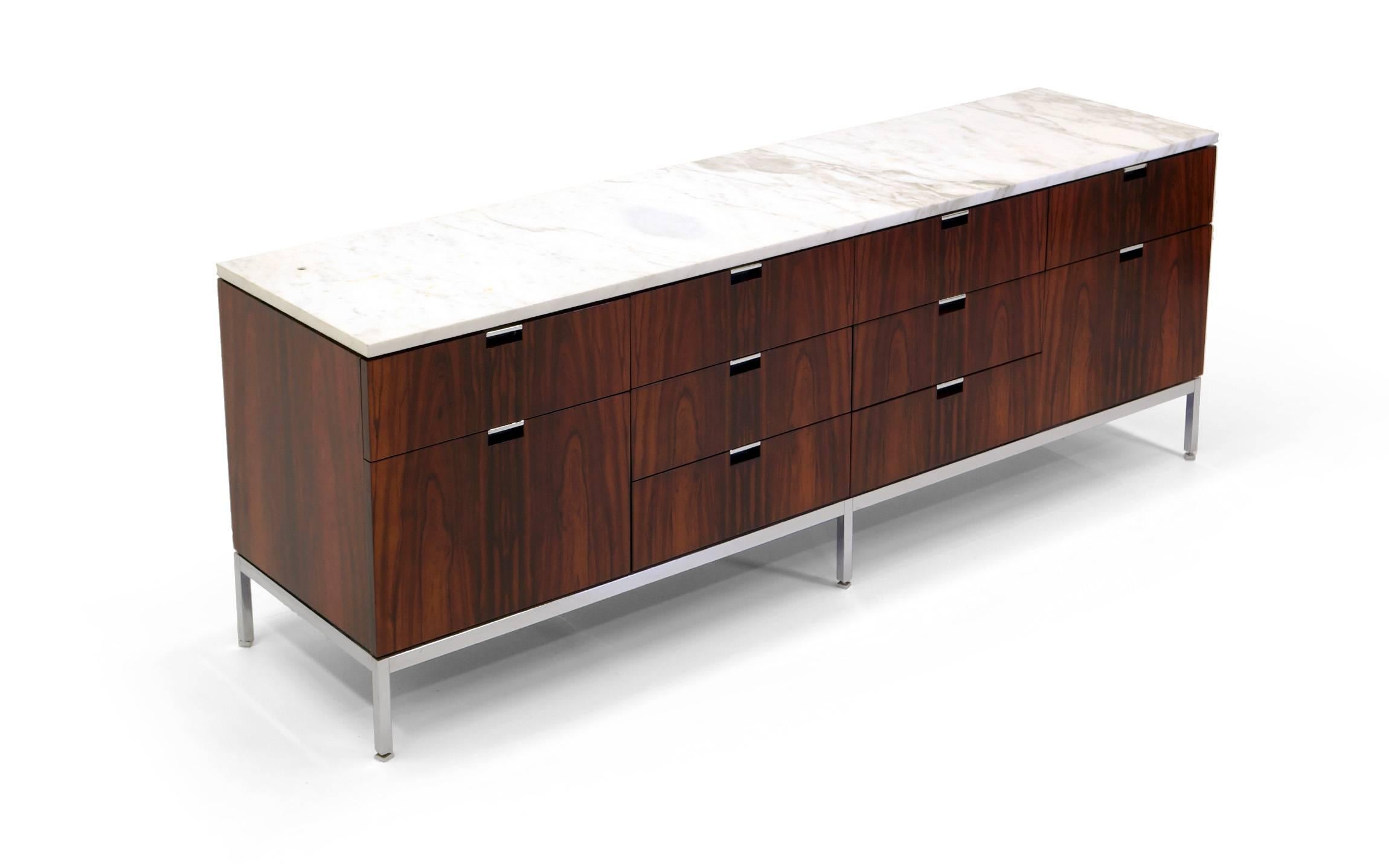 Beautiful matched grain Brazilian rosewood Florence Knoll credenza with marble top. This is an exceptional example of this design. Excellent condition. Minor spots to the marble top.