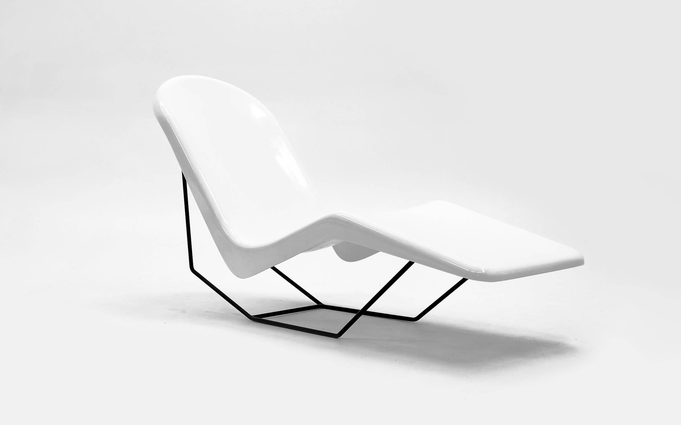 Pair of super cool and comfortable outdoor chaises in white fiberglass with black iron frames. These are adjustable. When you sit in the chair it stays upright. When you sit and put your foot on the ground and push back it goes to the reclining