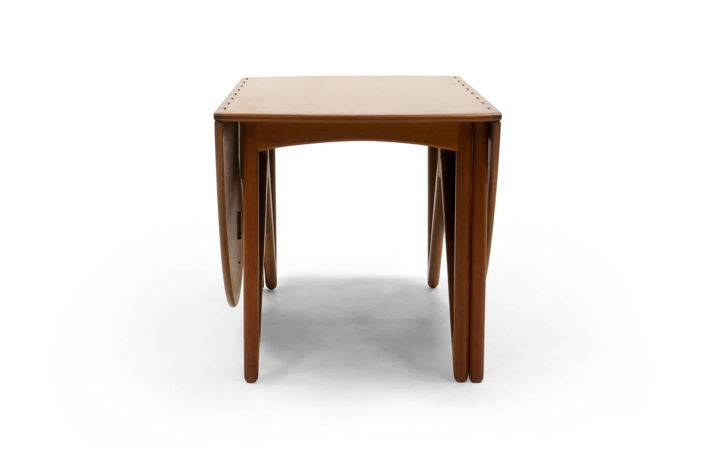 Kurt Ostervig sculptural base gateleg dining table. Expertly refinished. Beautiful. 
Collapsed the table is 28.5 inches wide. Fully extended, 77.5 inches wide.