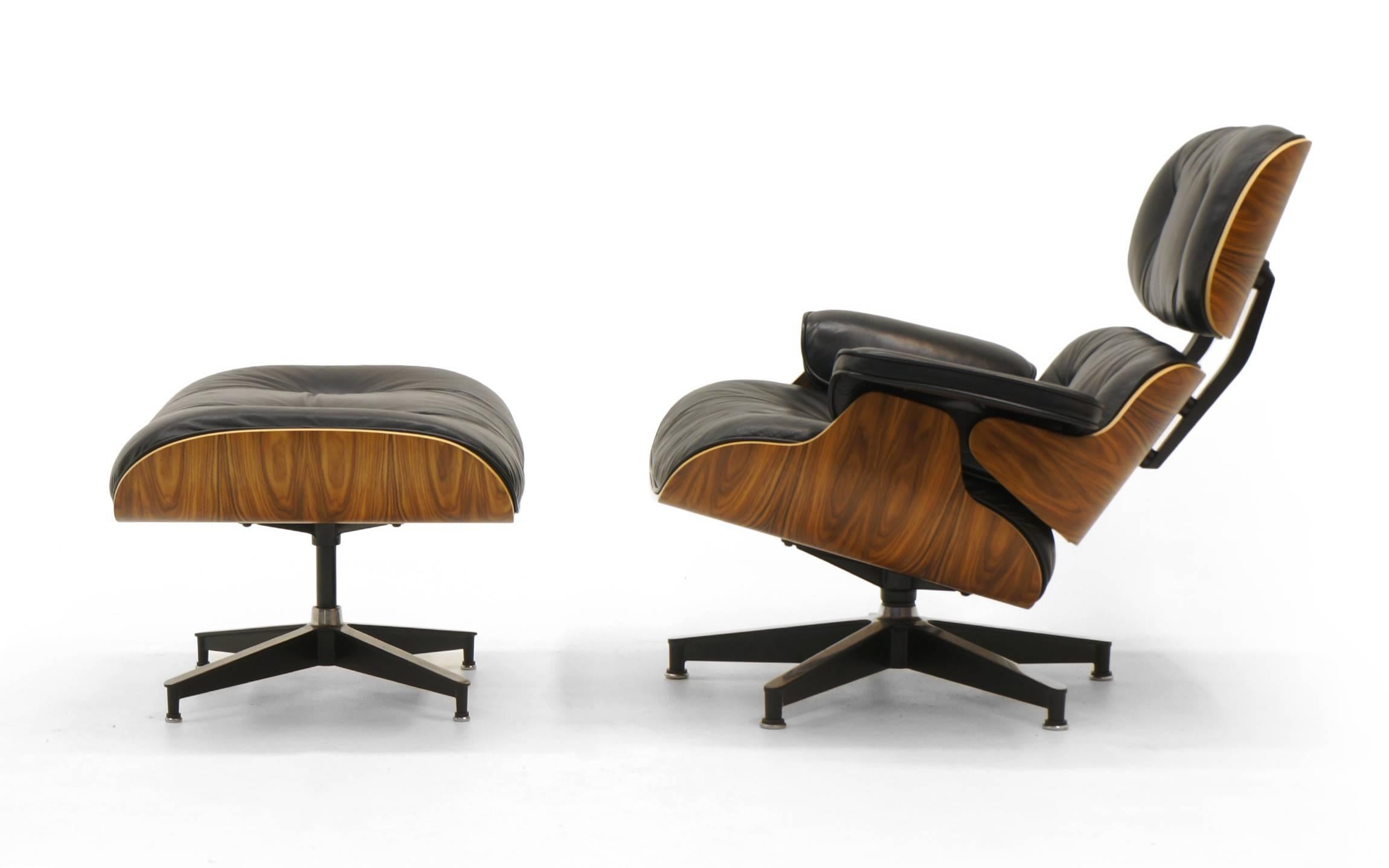 Rare and collectable Charles and Ray Eames 670 and 671 lounge chair and ottoman. To commemorate the 50th anniversary (1956-2006) of the design of the set, Herman Miller introduced the chair in Santos Palisander. This is a signed example from that