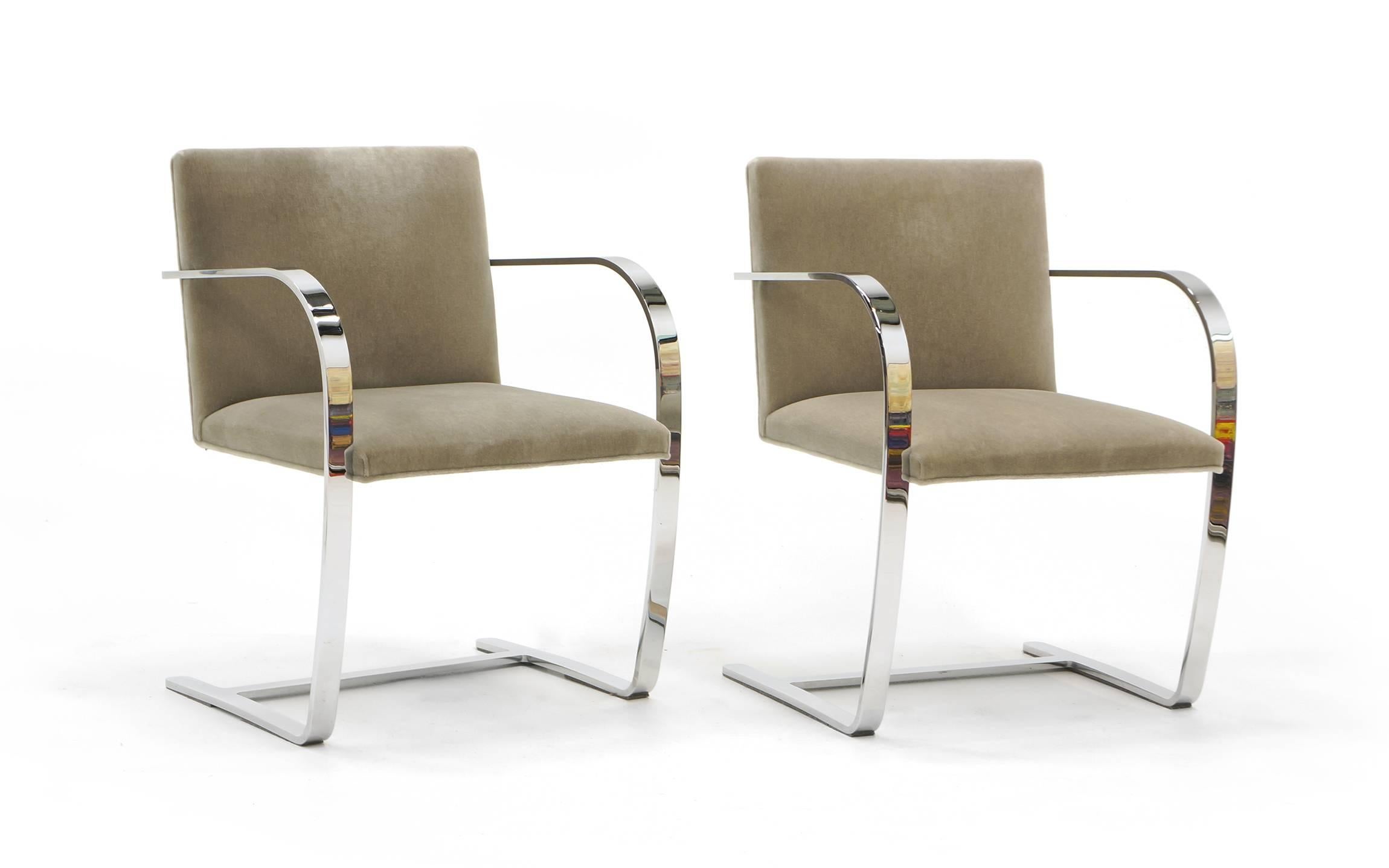 Brno chairs designed by Mies van der Rohe. Two chairs available. These are the original authorized Knoll production in triple chrome-plated to a mirror finish bar stock steel and original Knoll felt/velvet fabric. These make great dining chairs or