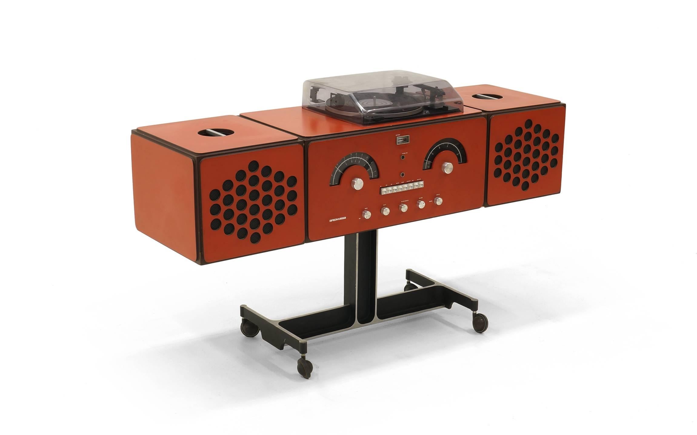 Original, Iconic Brionvega RR126 portable stereo. Fully serviced and working beautifully.  Converted to 110v for use in the USA.  The turntable, with original dust cover, is mounted to the top and the speakers lift off and on with an inset handle on