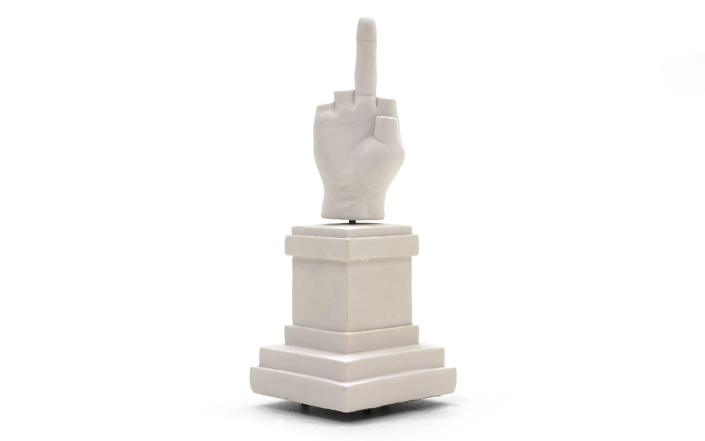 L.O.V.E. Music Box. Produced as a statement against Fascism. It is the Fascist salute with all but one finger cut off. The hand turns as the music plays. This is a 1:39 Scale Reproduction of L.O.V.E. by Maurizio Cattelan Installed in 2010 in Piazza