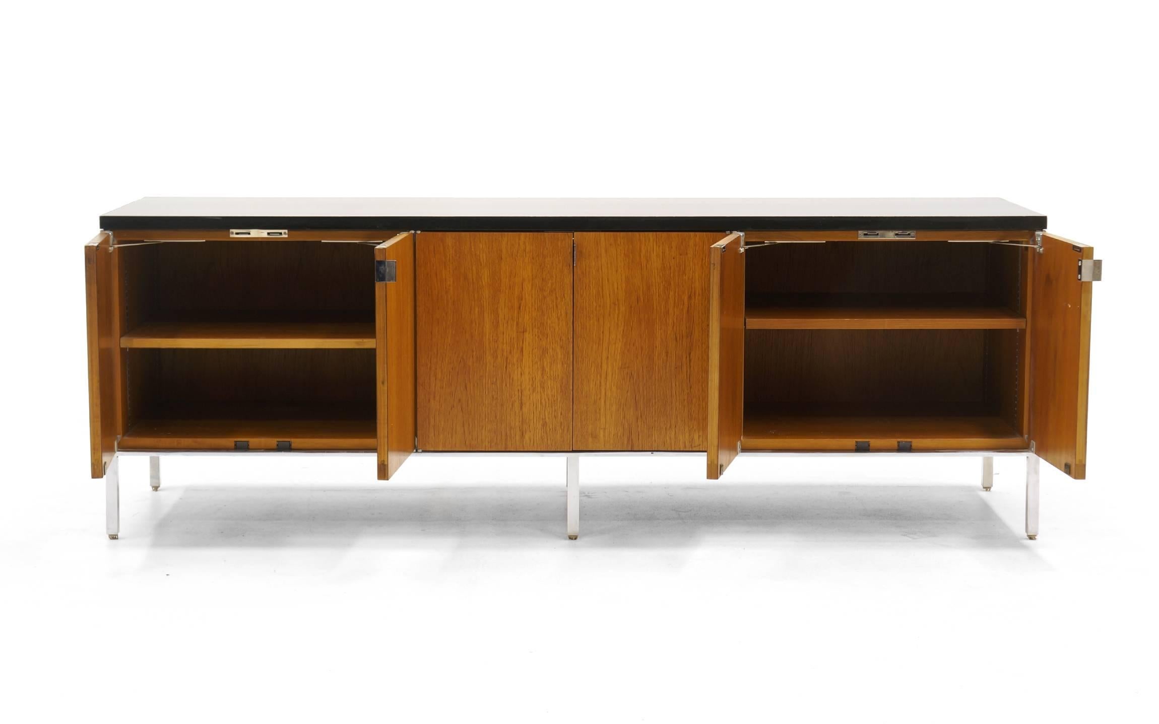 Florence Knoll credenza or media cabinet. Very versatile storage cabinet. The low height and the wide openings are ideal for components and a television on top. The original owner customer built an insert in the center section for vinyl albums. The