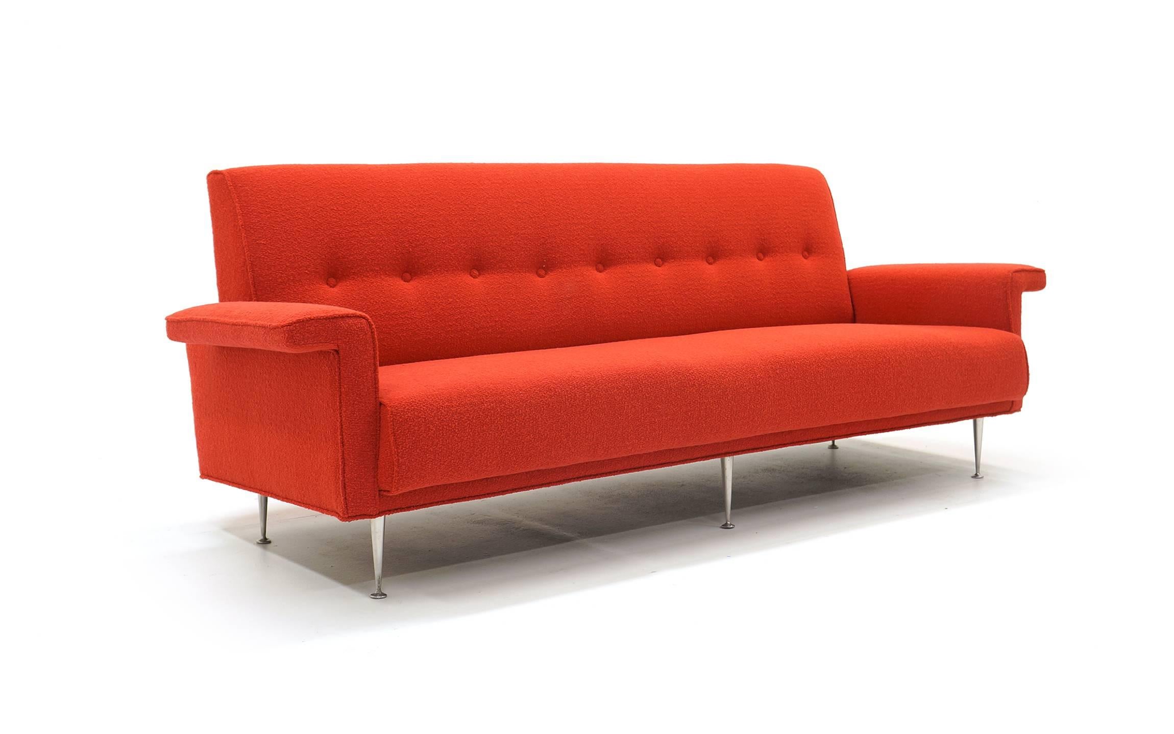 Extremely rare, produced for only one year, sofa designed by George Nelson for Herman Miller (As with much George Nelson seating it was designed in the Nelson office with John F. Pile). Expertly restored and reupholstered in a red (Crimson) Knoll